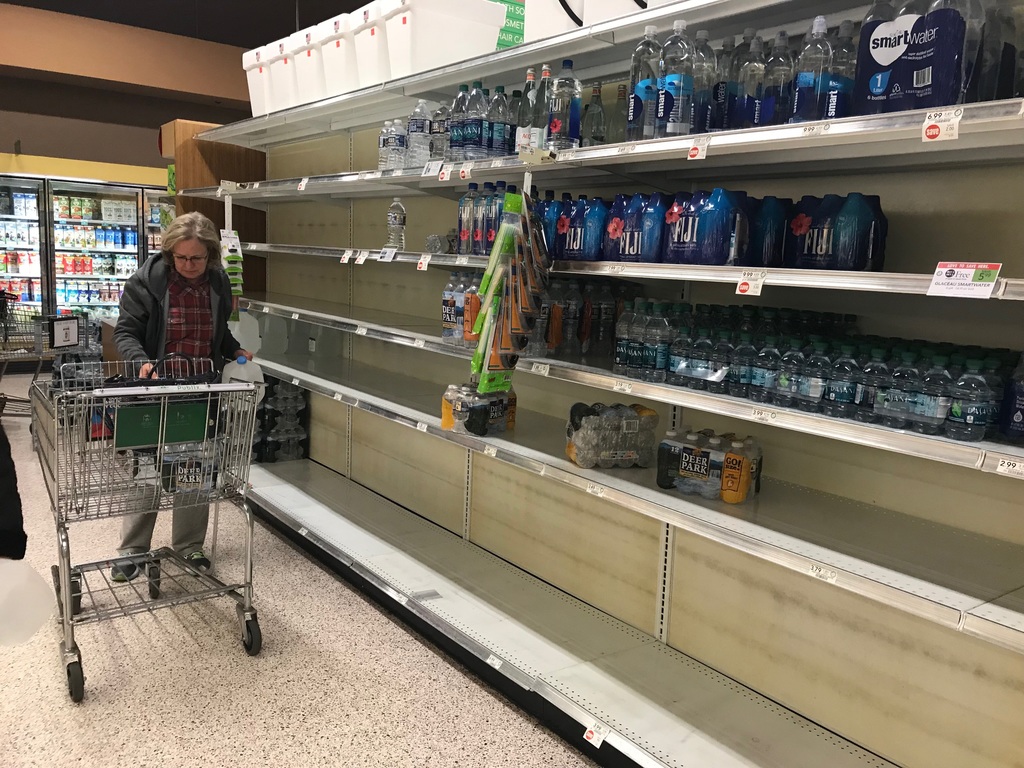 Shoppers at Publix at Town Brookhaven purchased the majority of bottled water on the normally well-stocked shelves. LIGAYA FIGUERAS / LIGAYA.FIGUERAS@AJC.COM