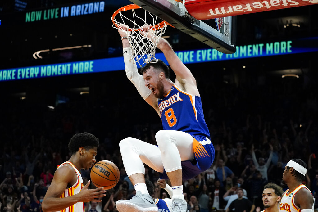 Phoenix Suns forward Frank Kaminsky (8) duns during the second half of an NBA basketball game against the Atlanta Hawks, Saturday, Nov. 6, 2021, in Phoenix. The Suns won 121-117. (AP Photo/Matt York)