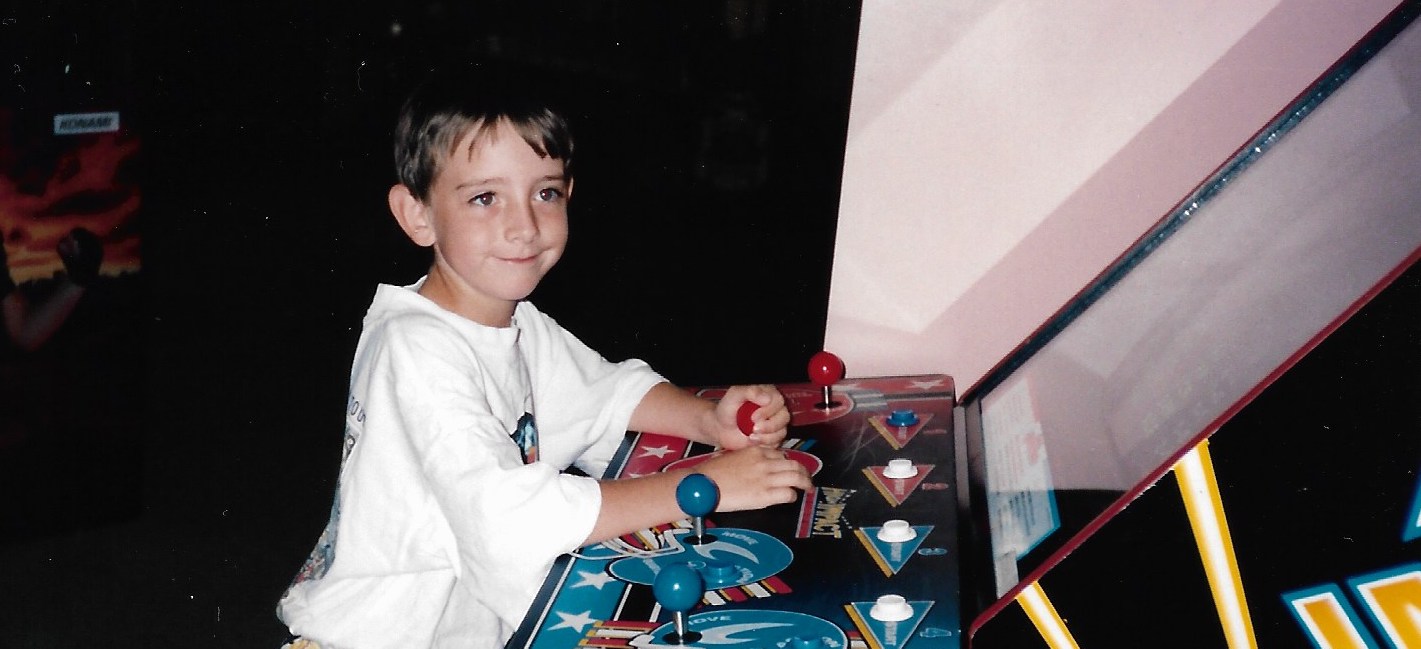 Young Bill King plays an arcade video game during his eighth birthday party at Challenges at North DeKalb Mall.  (Courtesy of the King family)