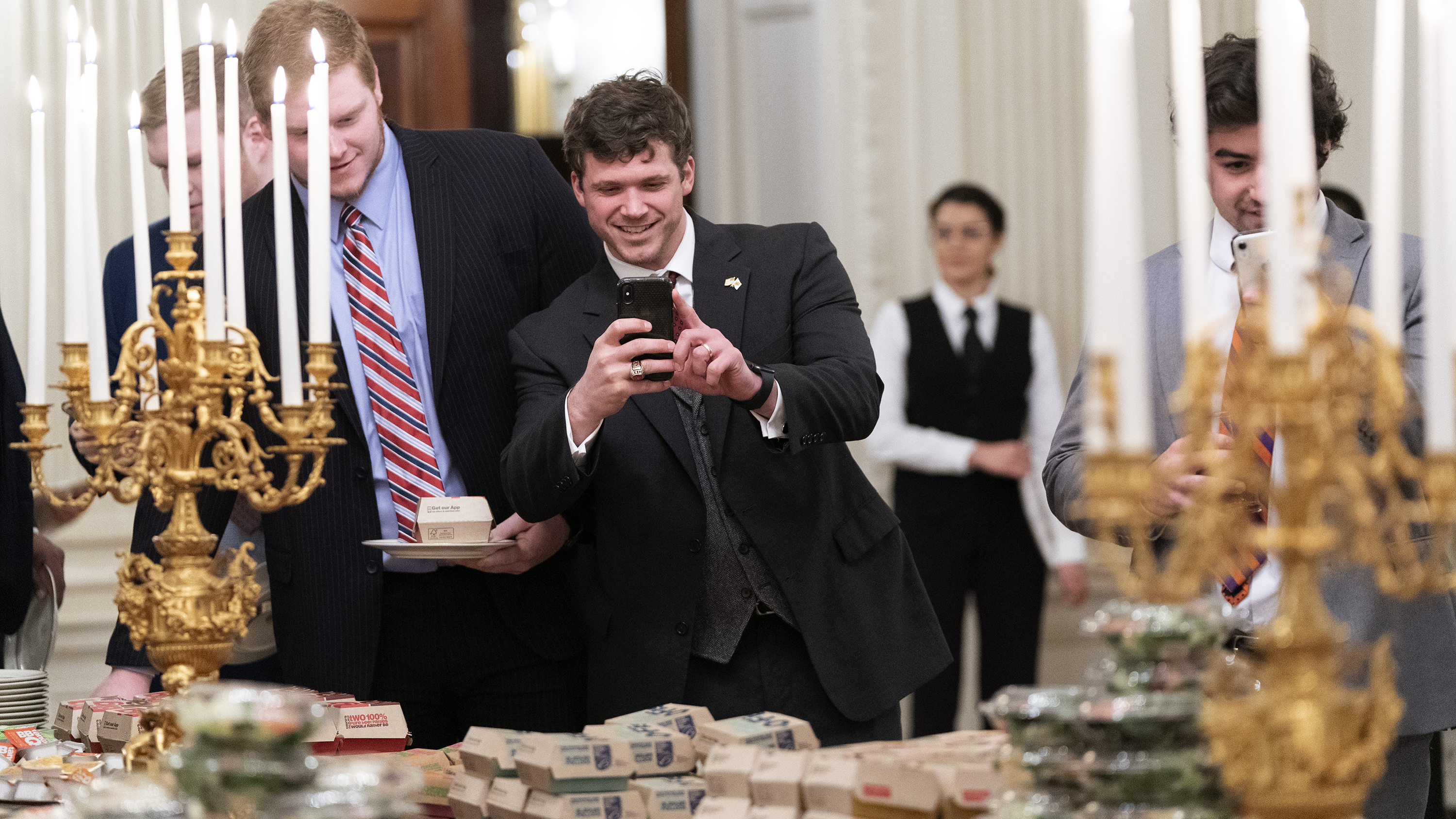 Trump treats Clemson football team to '1,000 burgers' during White House  visit