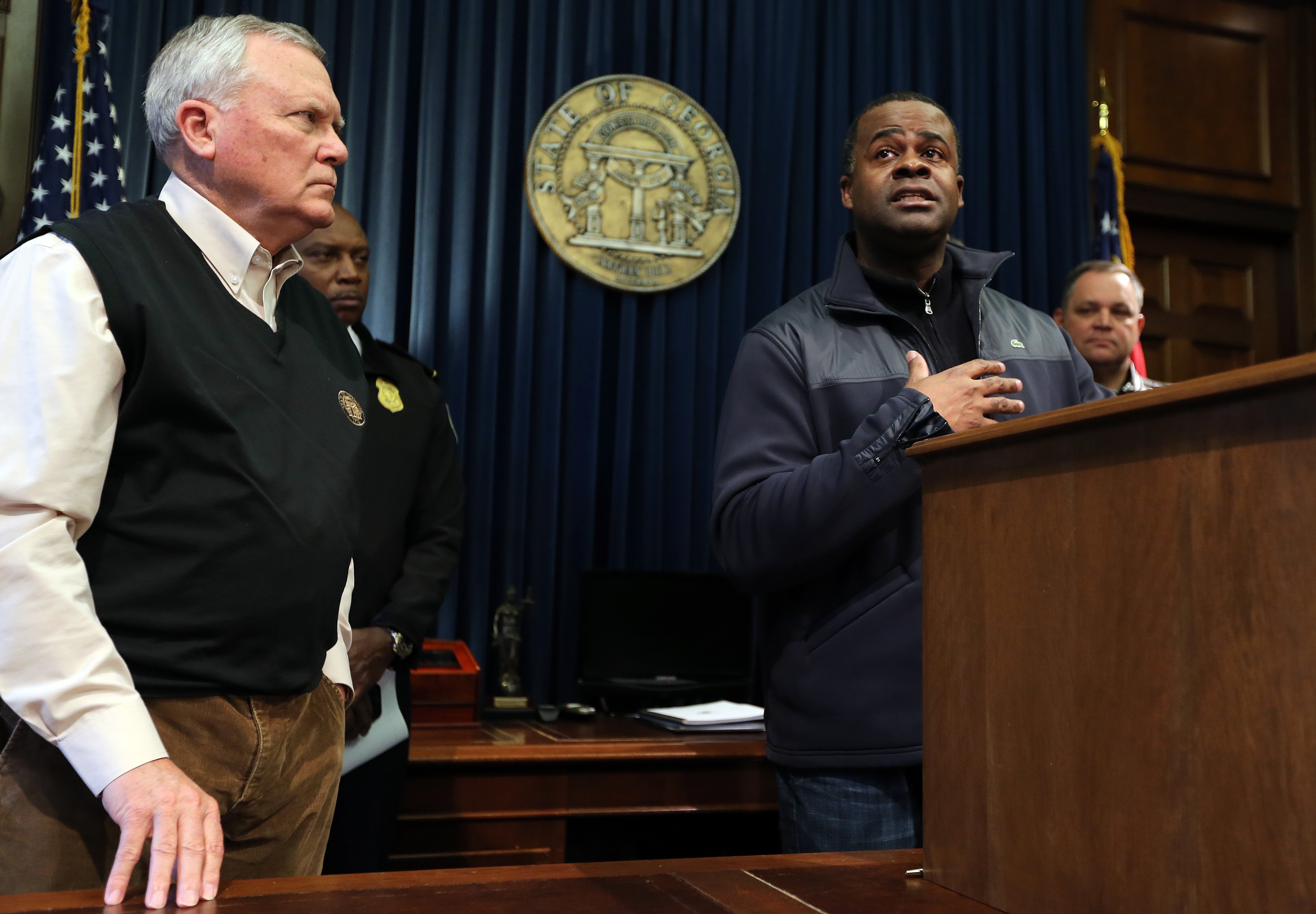 Both Gov. Nathan Deal and Atlanta Mayor Kasim Reed, seen here a press conference the day after the storm, took heat in SnowJam's aftermath. BEN GRAY / BGRAY@AJC.COM