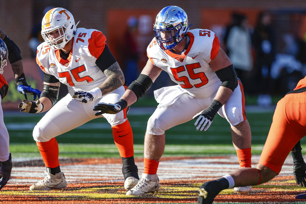American Team offensive linemen Cade Mays of Tennessee (75) and Luke Fortner of Kentucky (55) respond at the snap during the third quarter of an NCAA Senior Bowl college football game, Saturday, Feb. 5, 2022, in Mobile, Ala. (AP Photo/Butch Dill)