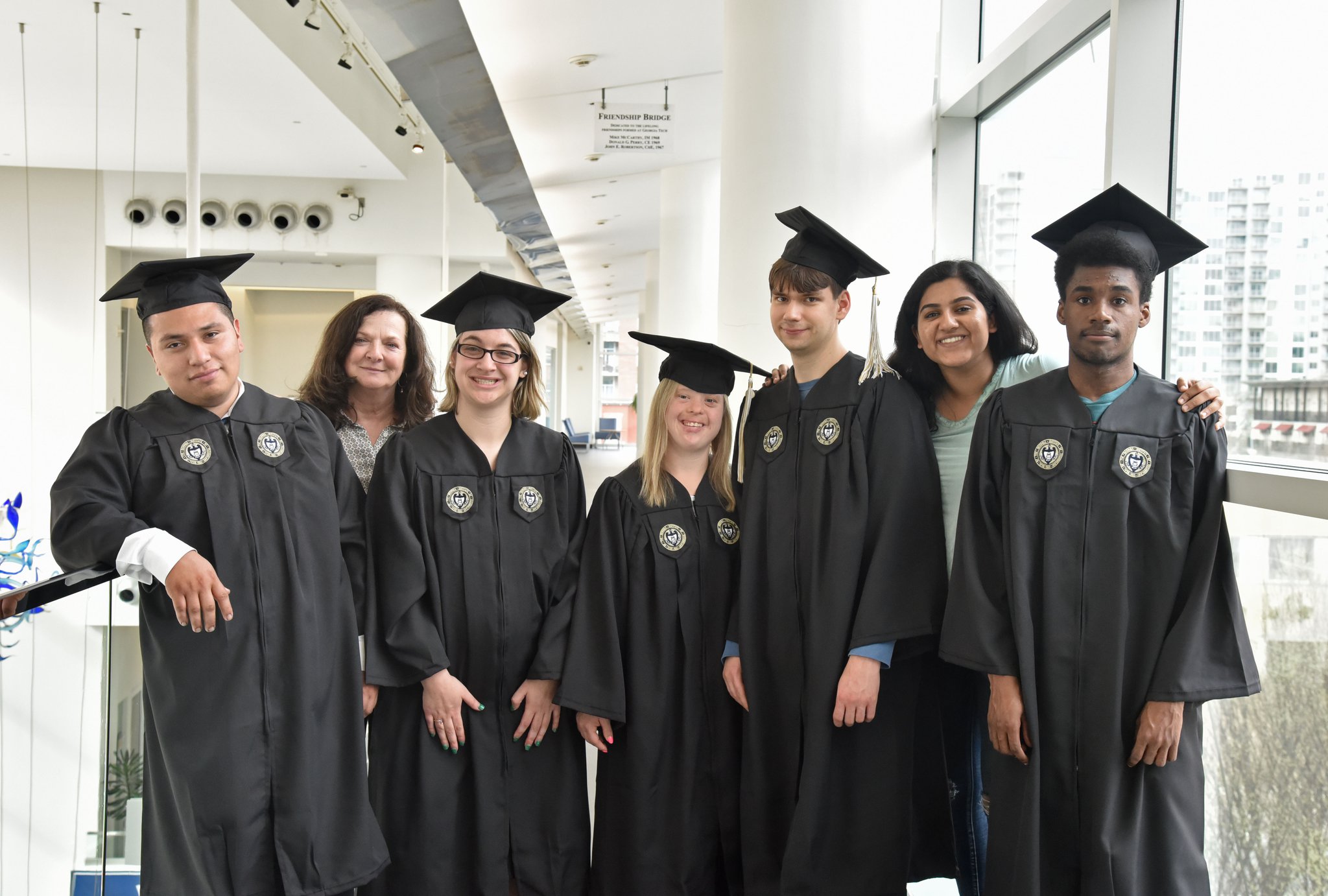 First graduating class of EXCEL program for students with mild intellectual and developmental disabilities, (from left) Frankie Sanders, Rene Reese (career development coordinator), Faith Roman, Alex Goodman, Kurt Vogel, Ankita Raghupathy (teaching assistant) and Rashad Isaac at Georgia Tech’s Scheller College of Business.