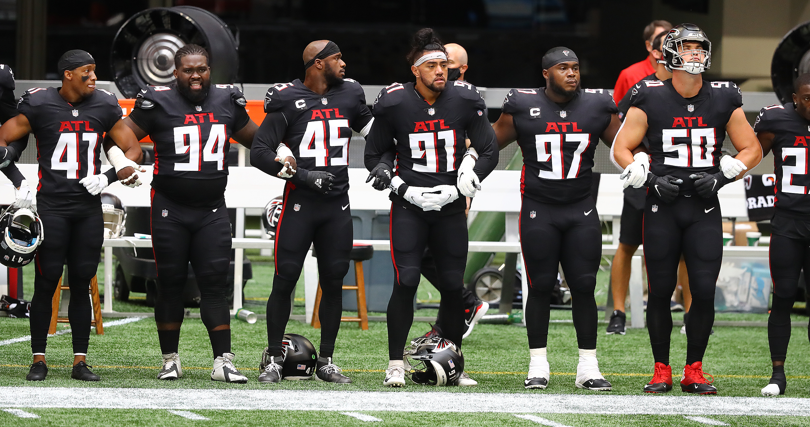 Falcons stand during both anthems; Seahawks protest