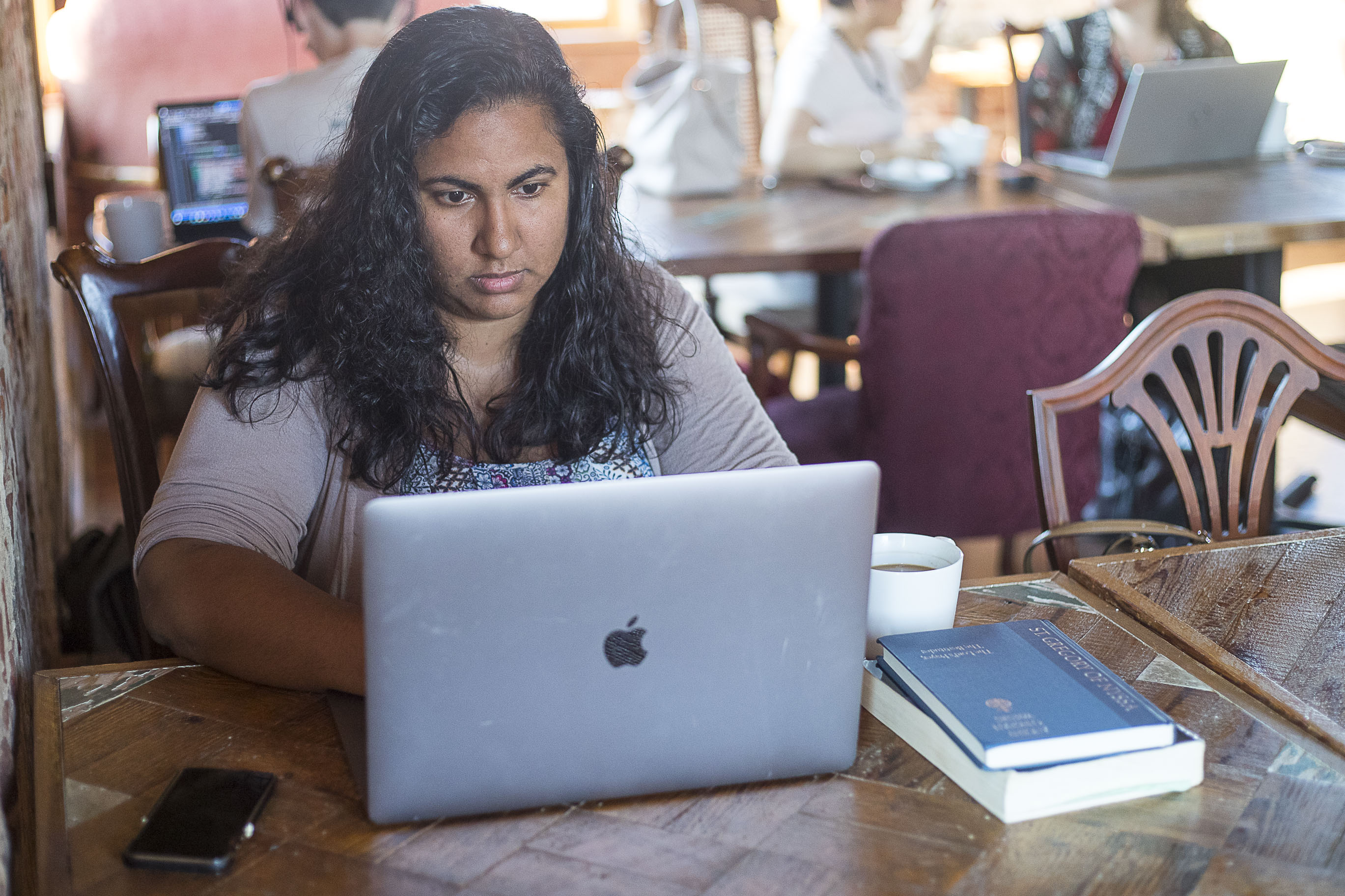 Sunita Theiss works on a monthly devotional for In Touch Ministries at Moonbird Coffee in Chamblee, Friday, September 27, 2019. Sunita is a writer and content strategist for In Touch Ministries which is based in metro-Atlanta. (Alyssa Pointer/alyssa.pointer@ajc.com)