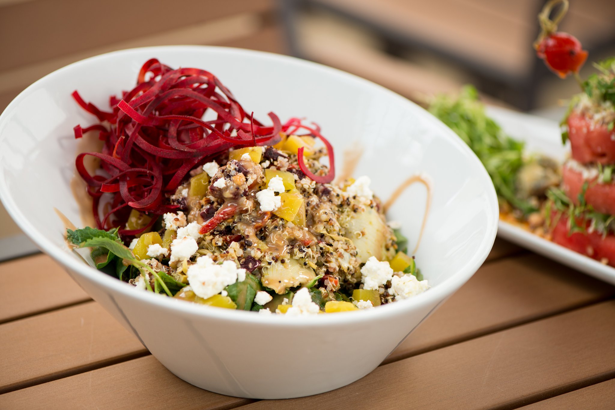 One of the new items at Sage Woodfire Tavern in Buckhead is a Roasted Beet and Baby Kale Quinoa Bowl with sun dried tomato, smoked almond, artichoke hearts, dates, goat cheese, mint, and chimichurri. Photo credit- Mia Yakel.