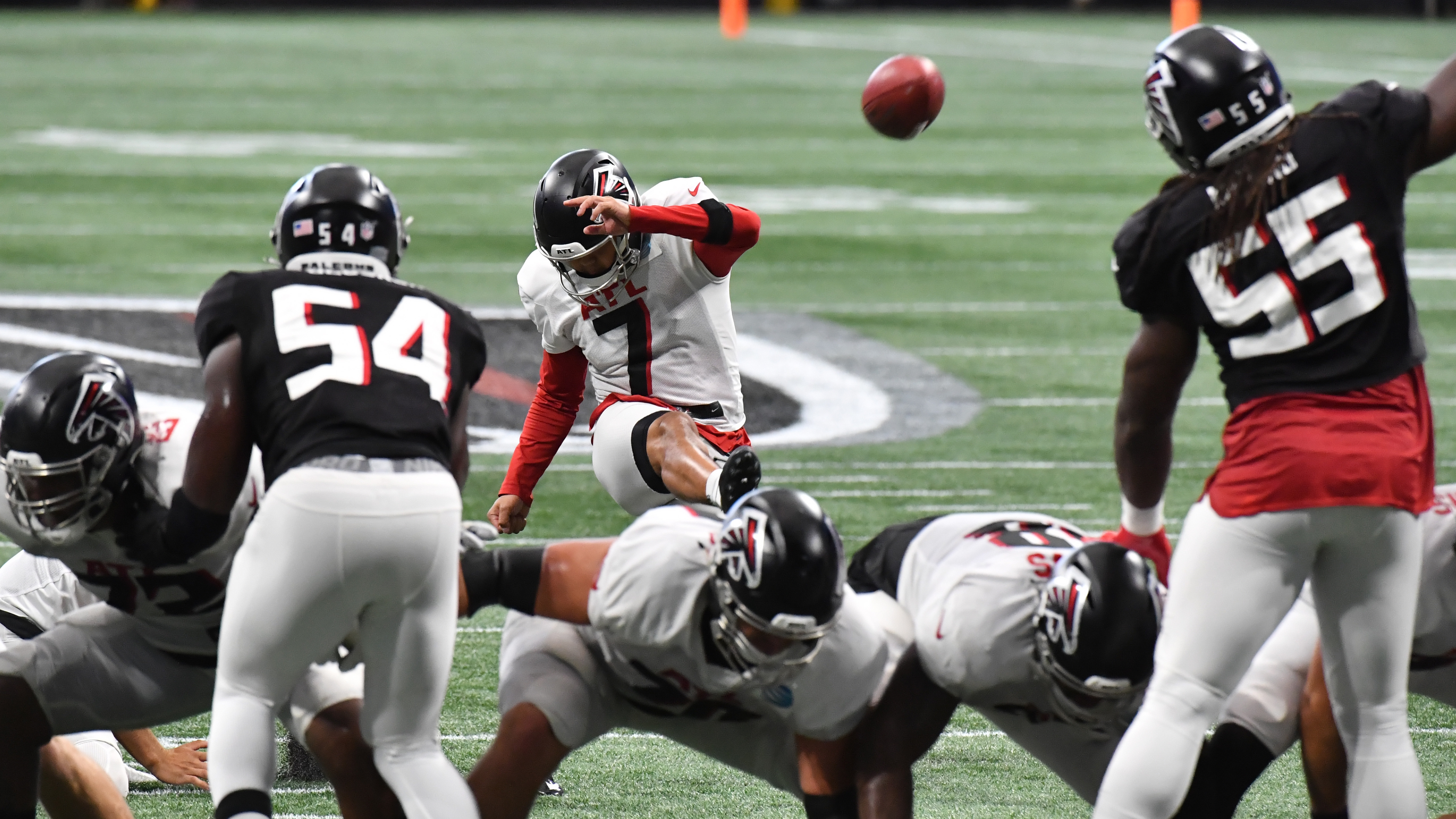 Atlanta Falcons kicker Younghoe Koo (7) practices kicking field