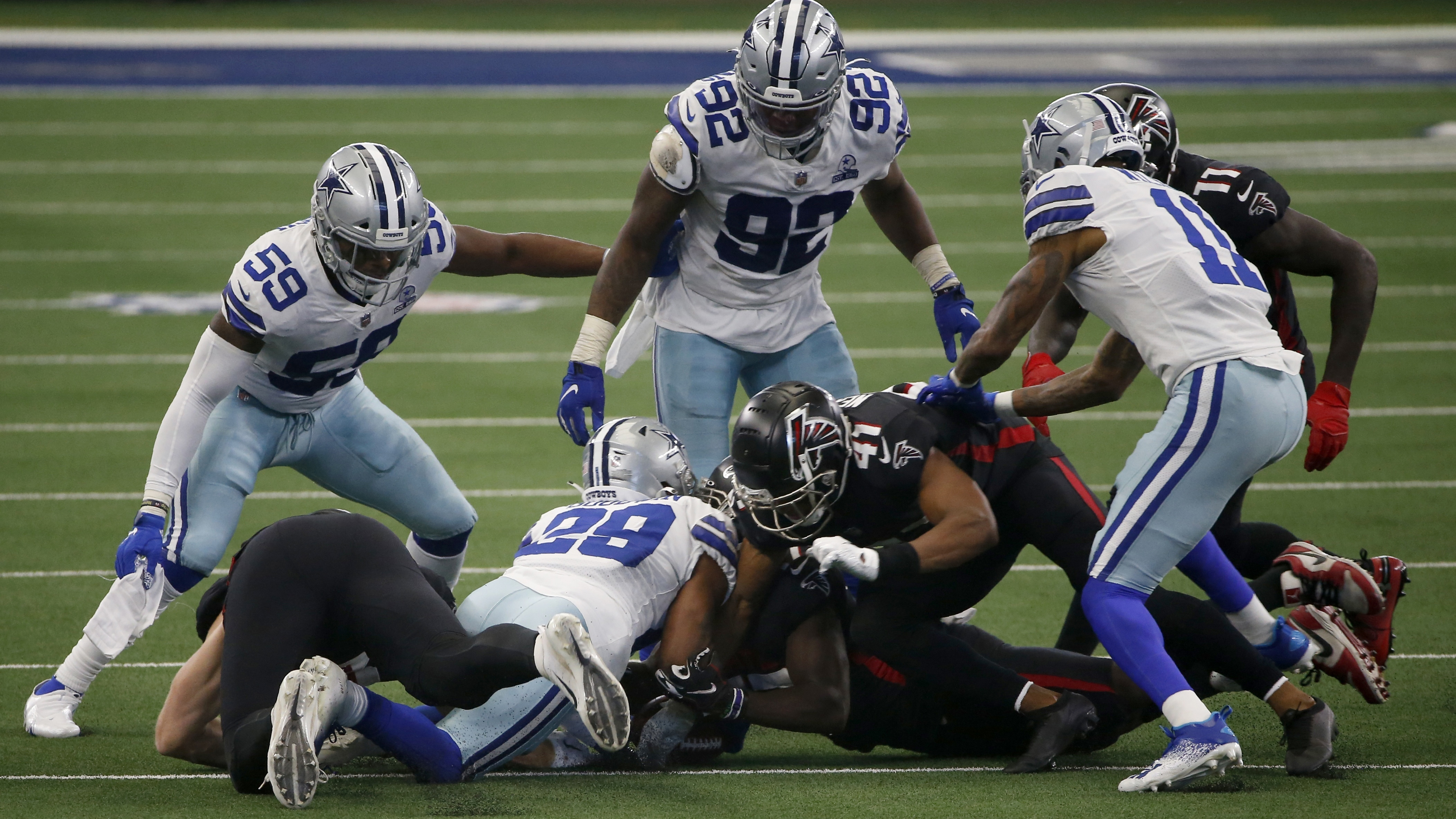 Cowboys complete comeback, stun Falcons in high-scoring shootout