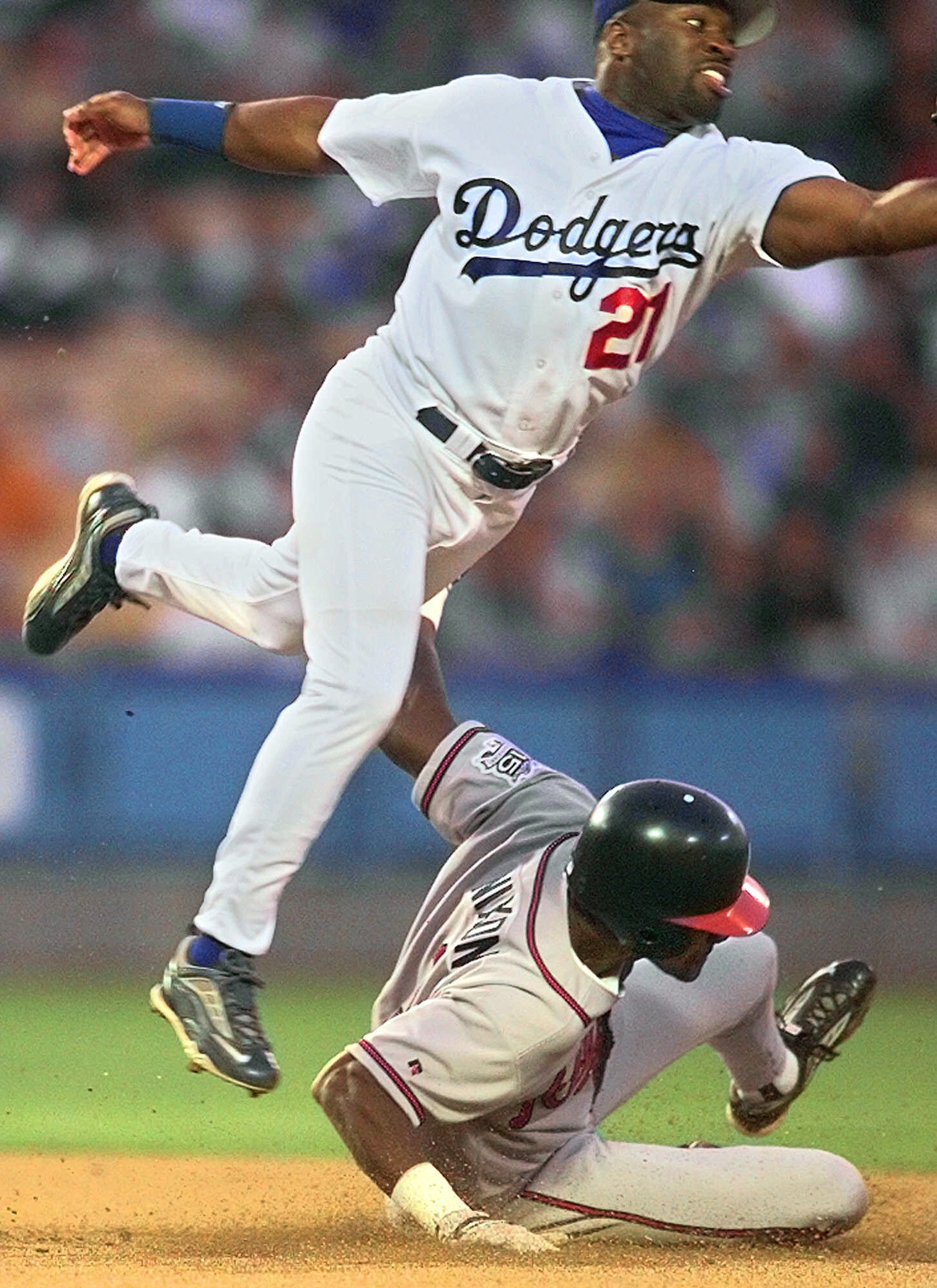 Atlanta Braves' Otis Nixon (1) flips his helmet after he was