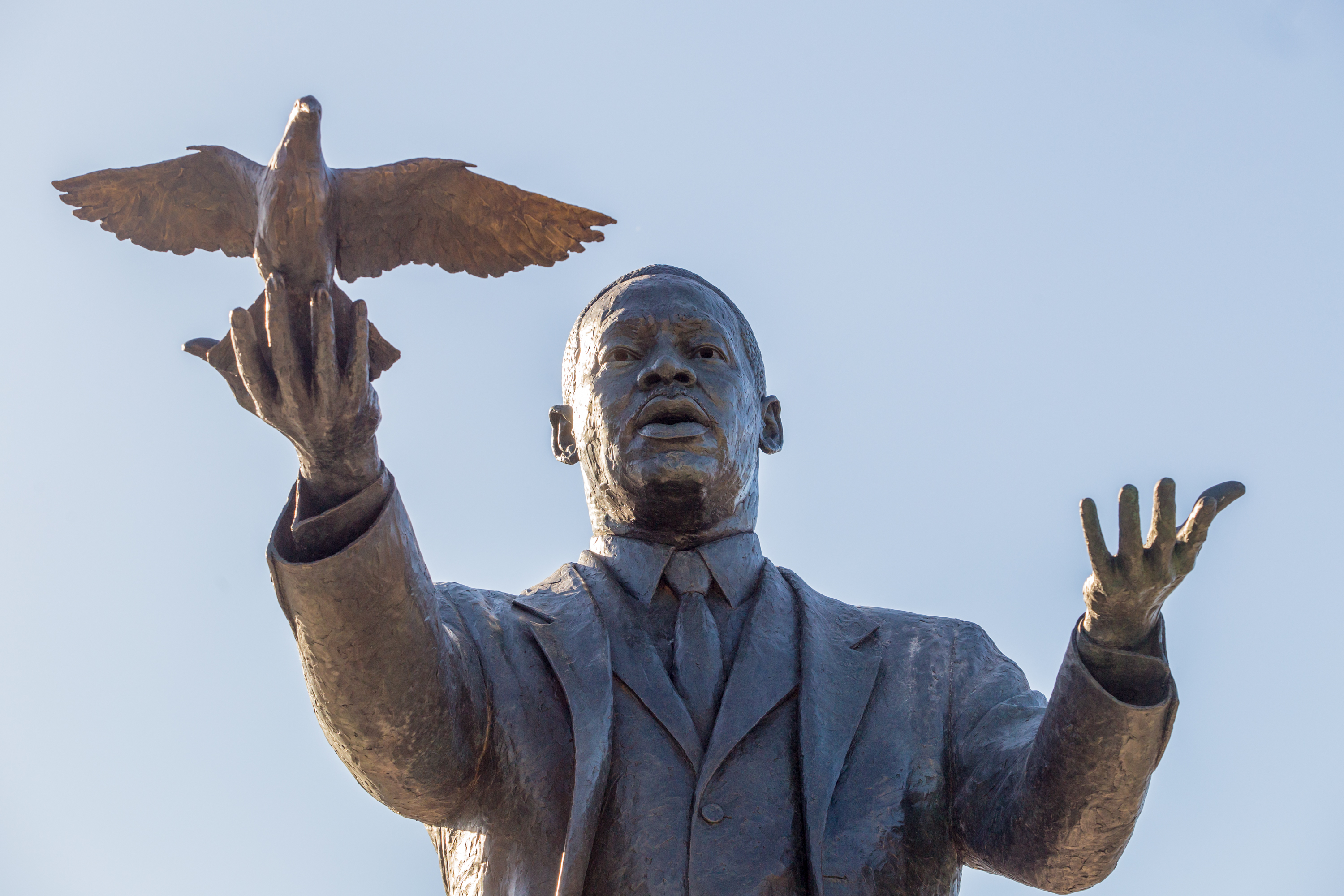 City of Atlanta unveils the bronze statue "Hope Moving Forward" honoring the life and legacy of Dr. Martin Luther King Jr. on Friday, January 15, 2021 near the intersection of Northside Drive and MLK Jr Drive. This is the first of seven art installations commissioned by the city to honor MLK. (Jenni Girtman for The Atlanta Journal Constitution)
