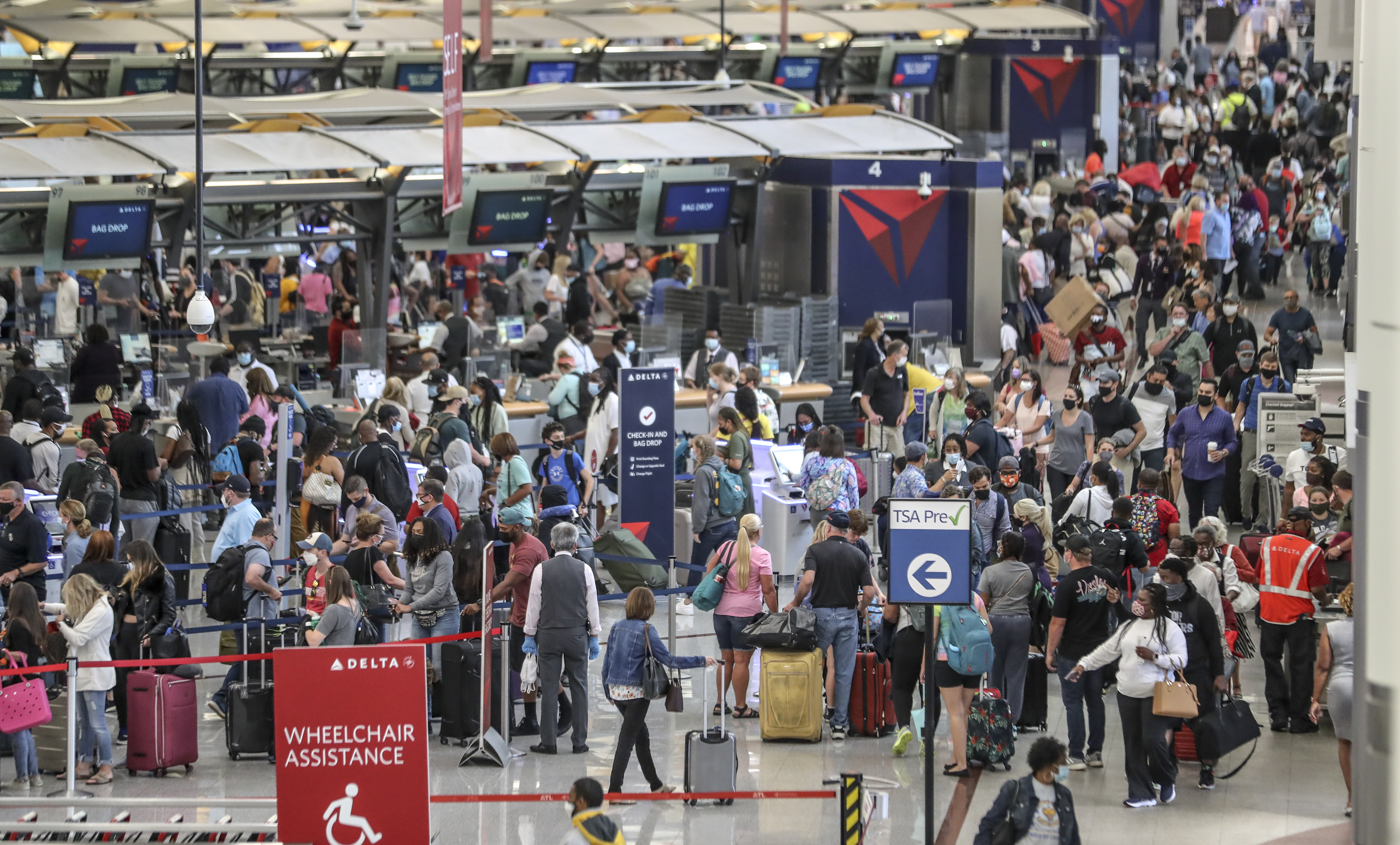 May 27, 2021 Hartsfield-Jackson International Airport: The Delta ticket counters were swarmed as crowds have returned to AtlantaÕs Hartsfield-Jackson International Airport for the Memorial Day weekend travel period as seen on Thursday, May 27, 2021. (John Spink / John.Spink@ajc.com)