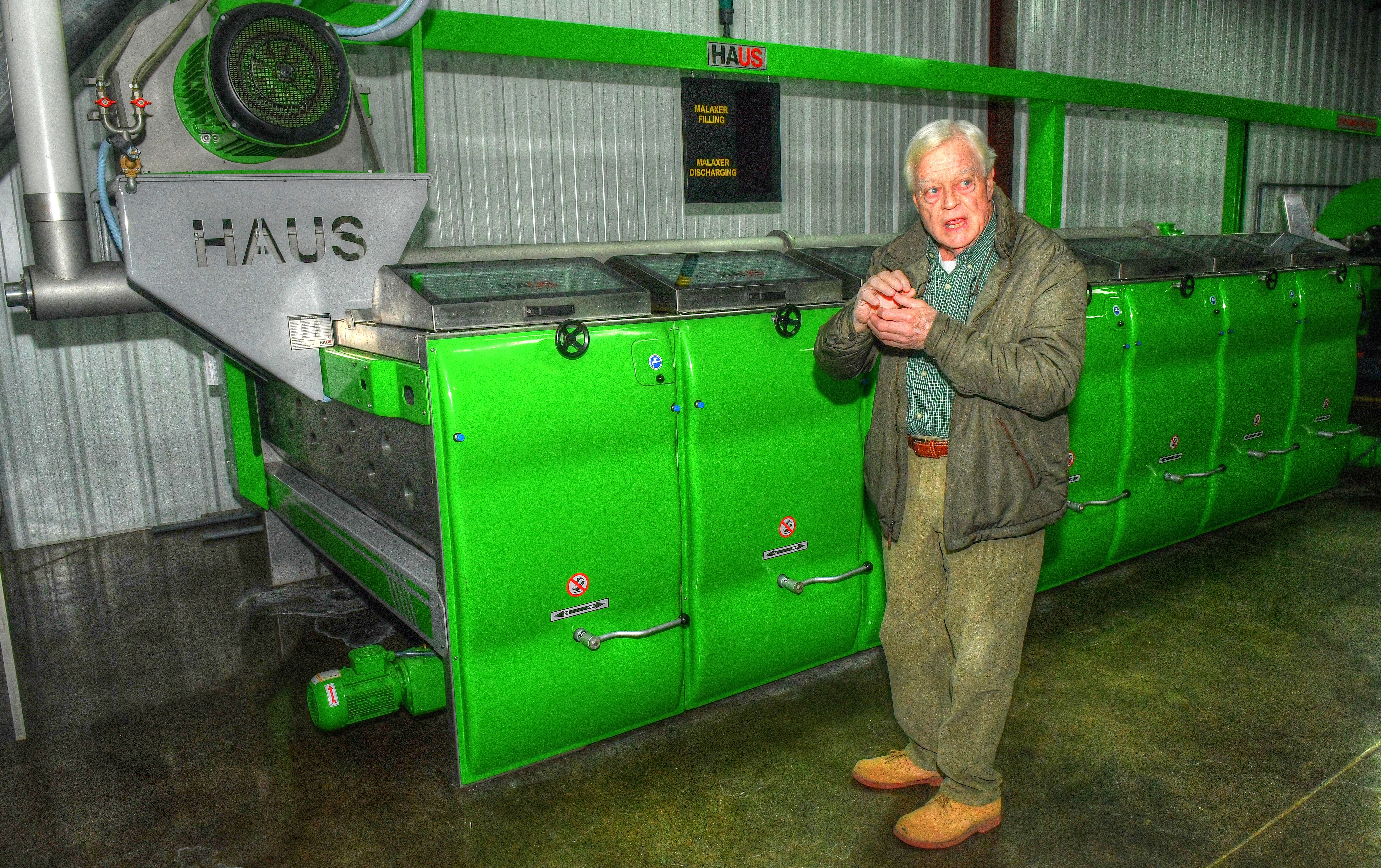 Standing by the malaxer, which grinds olives into a mash so the oil can be extracted, Cooley Hobdy explains the milling and bottling process at his facilities.
Contributed by Chris Hunt for The Atlanta Journal-Constitution)