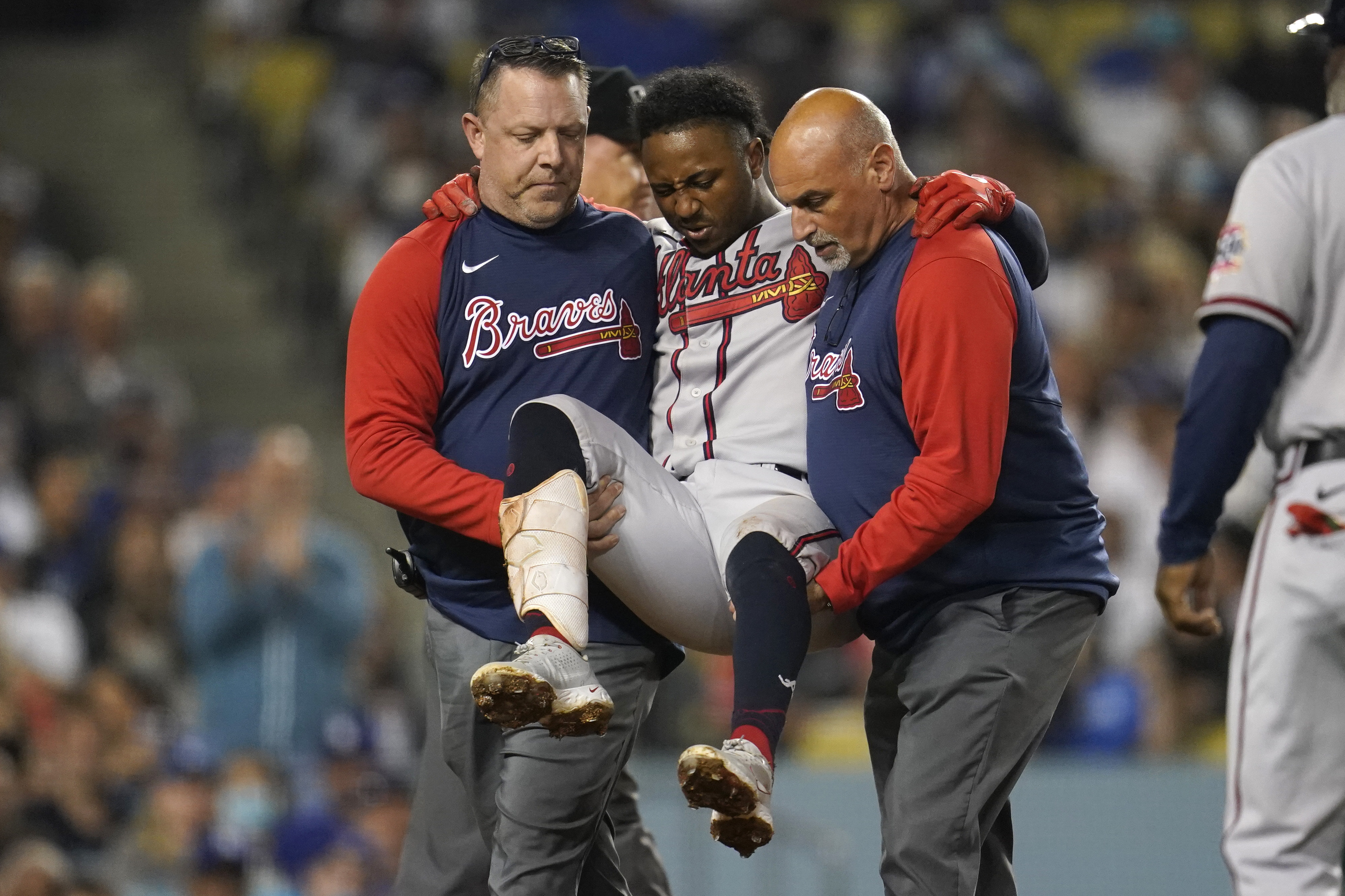 Braves' Ozzie Albies carried off field but X-rays bring good news