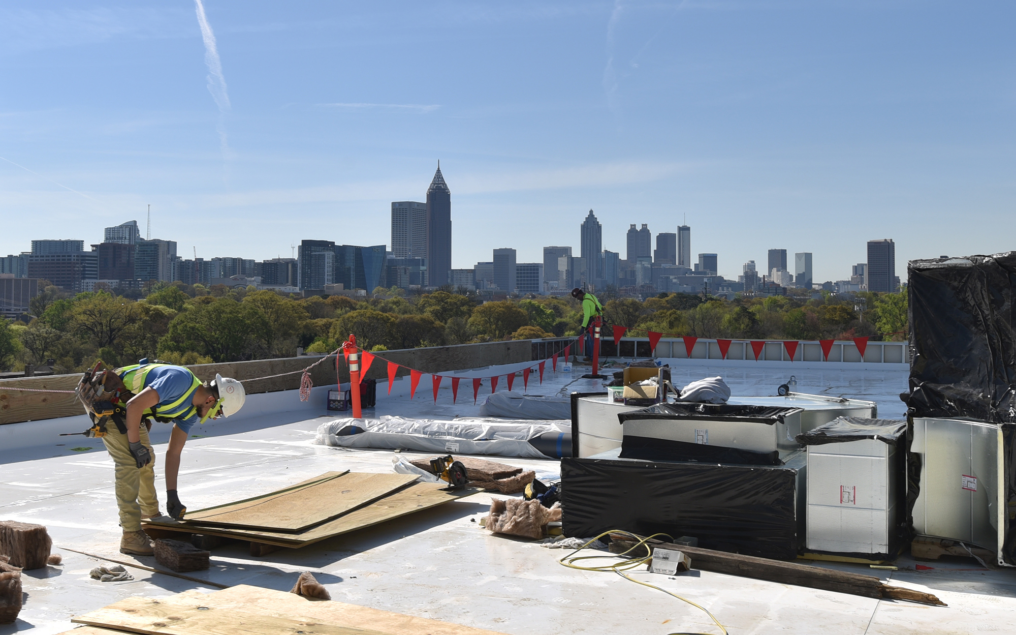 The construction crew works on the rooftop of the T3 West Midtown construction site at Atlantic Station. The development cost — which Hines didn’t disclose — is about 10 percent to 15 percent more than a conventional office building per square foot, according to John Heagy, senior managing director for Hines Southeast Region.