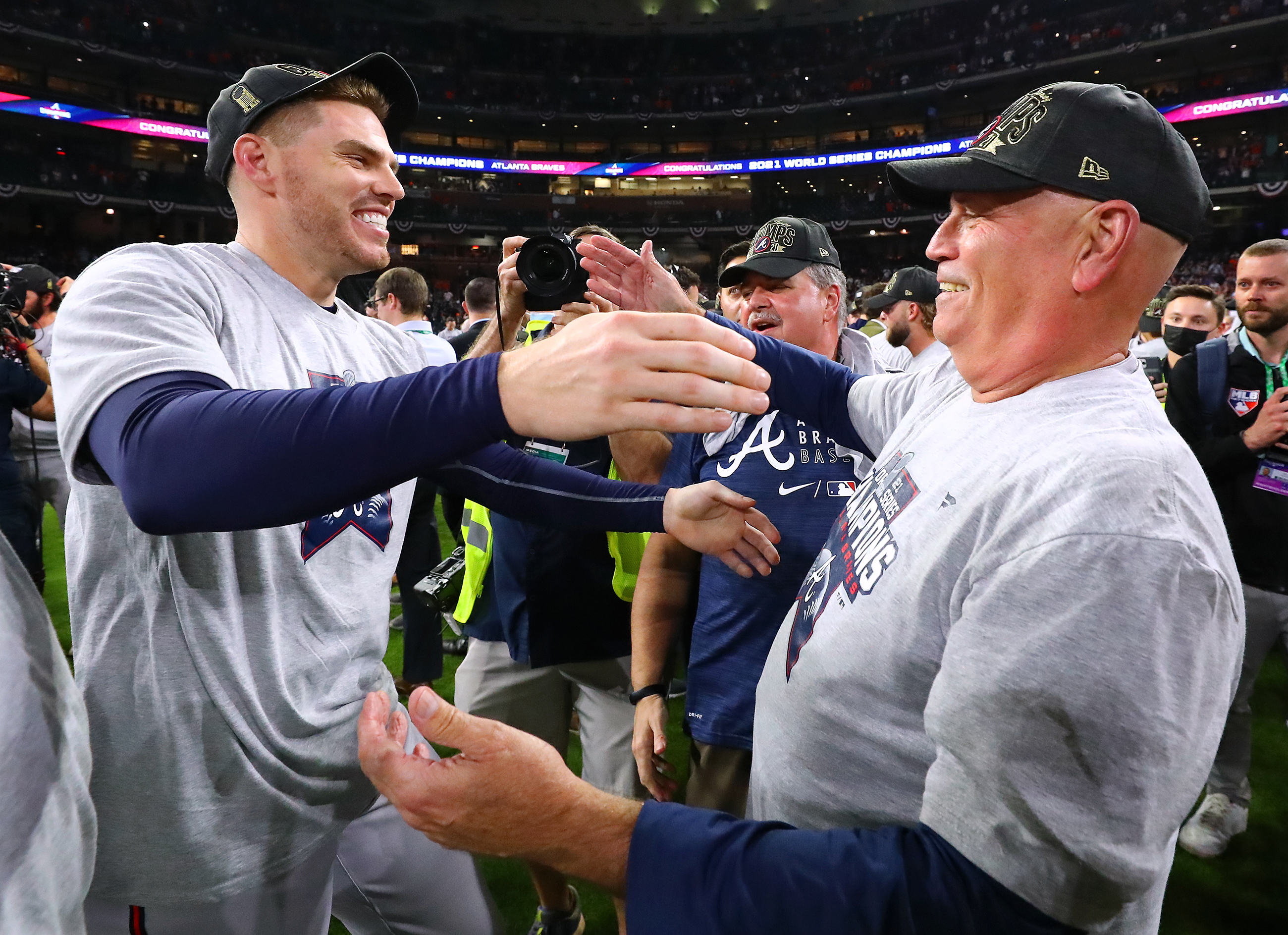 Freddie Freeman and manager Brian Snitker find each other in the midst of the celebration and embrace after beating the Astros in game 6 to win the World Series on Tuesday, Nov. 2, 2021, in Houston. Freeman is now a free agent. “Curtis Compton / Curtis.Compton@ajc.com”