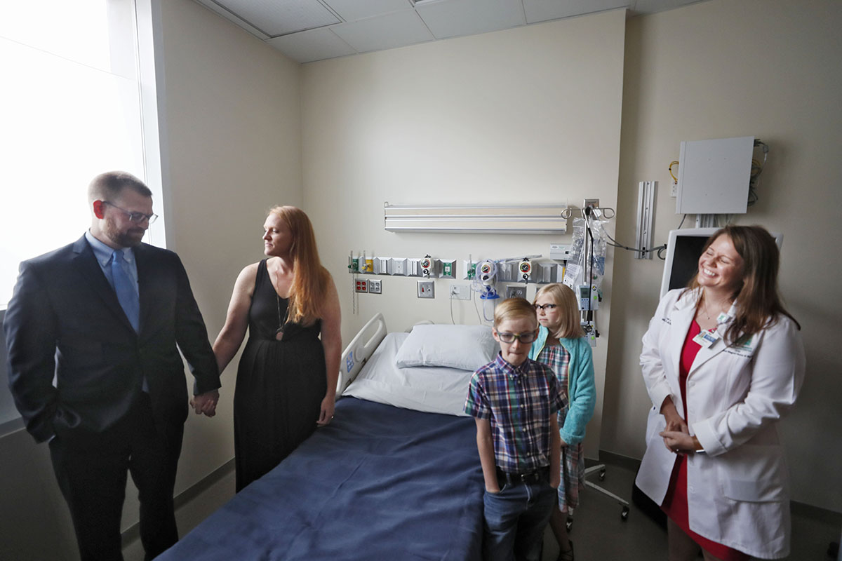 August 2, 2019, 2019 - Atlanta - Dr. Kent Brantly (from left) tours the Serious Communicable Diseases Unit with his wife, Amber, children, Stephen, 8, and Ruby, 10, and Sharon Vanairsdale, a member of the nursing staff that treated him. Members of the Emory University Hospital medical team who successfully treated the first patients with Ebola virus disease in the United States reunited with former patients Dr. Kent Brantly, and Nancy Writebol on Friday, Aug. 2. This marks the fifth anniversary of Dr. Brantly's arrival at Emory University Hospital as the first patient with Ebola virus disease to be treated in the U.S. Bob Andres / robert.andres@ajc.com