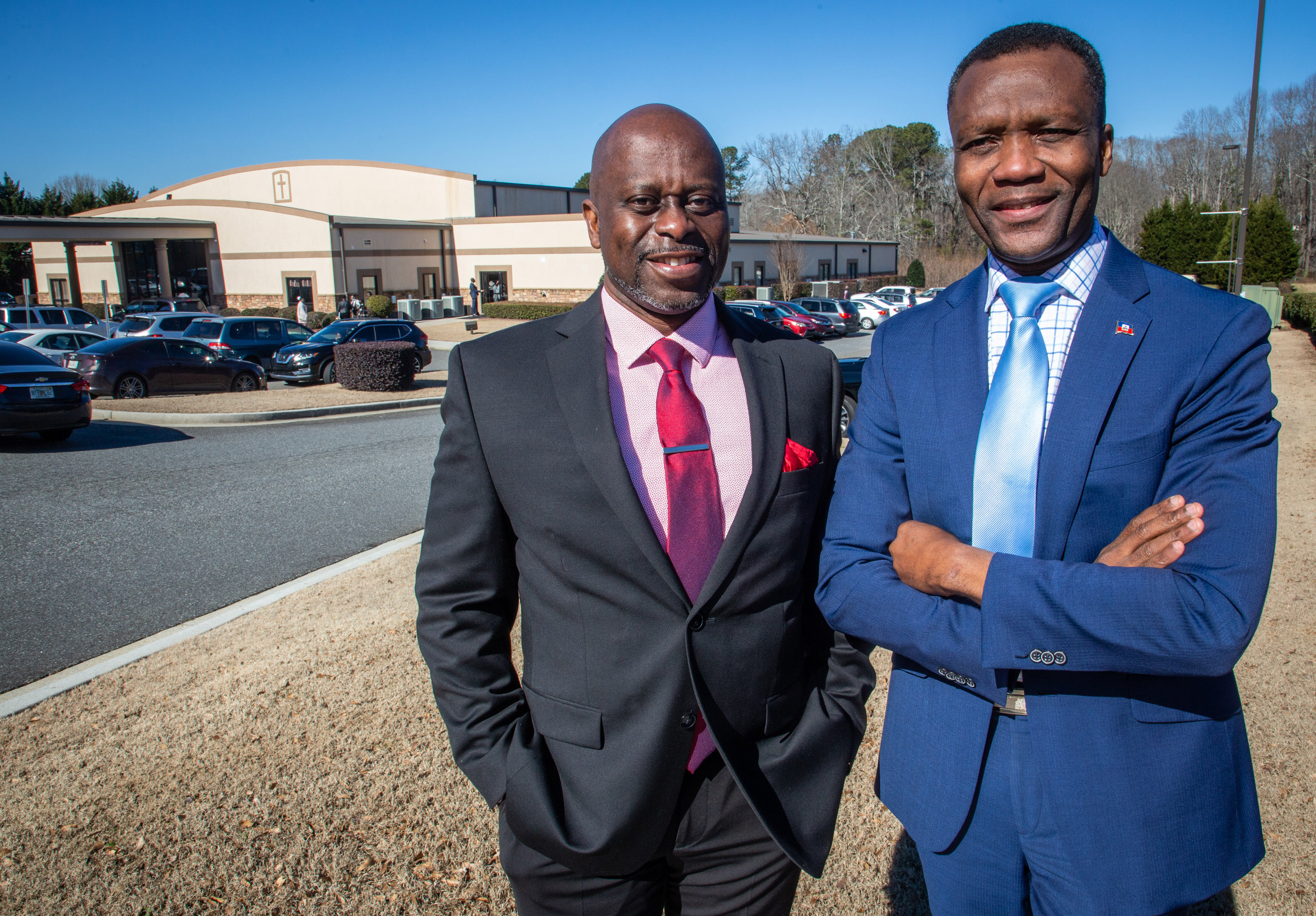 Watson Escarment (L) and Claude-Henry Pierre pose for a photograph outside the Good Samaritan Haitian Alliance Church Lawrenceville Sunday, February 6, 2022. STEVE SCHAEFER FOR THE ATLANTA JOURNAL-CONSTITUTION