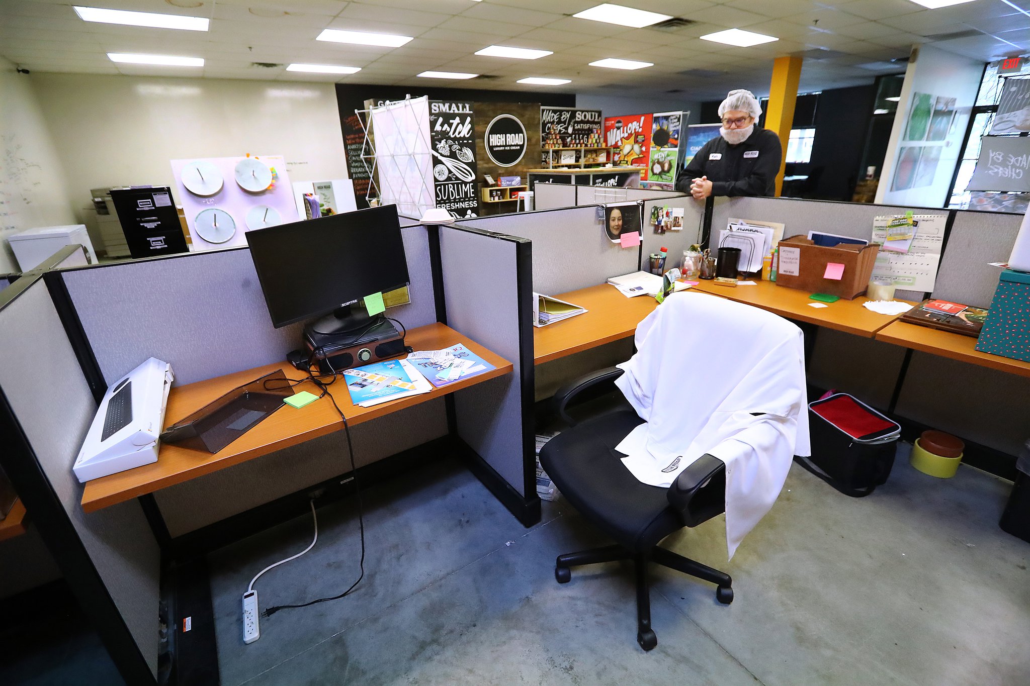 Owner Keith Schroeder pauses in what he calls an eerily quiet sales and marketing department at his business High Road Ice Cream on Tuesday, March 31, 2020, in Marietta. The department is normally bustling with 16 employees who are all now working from home. (Photo: Curtis Compton / ccompton@ajc.com)