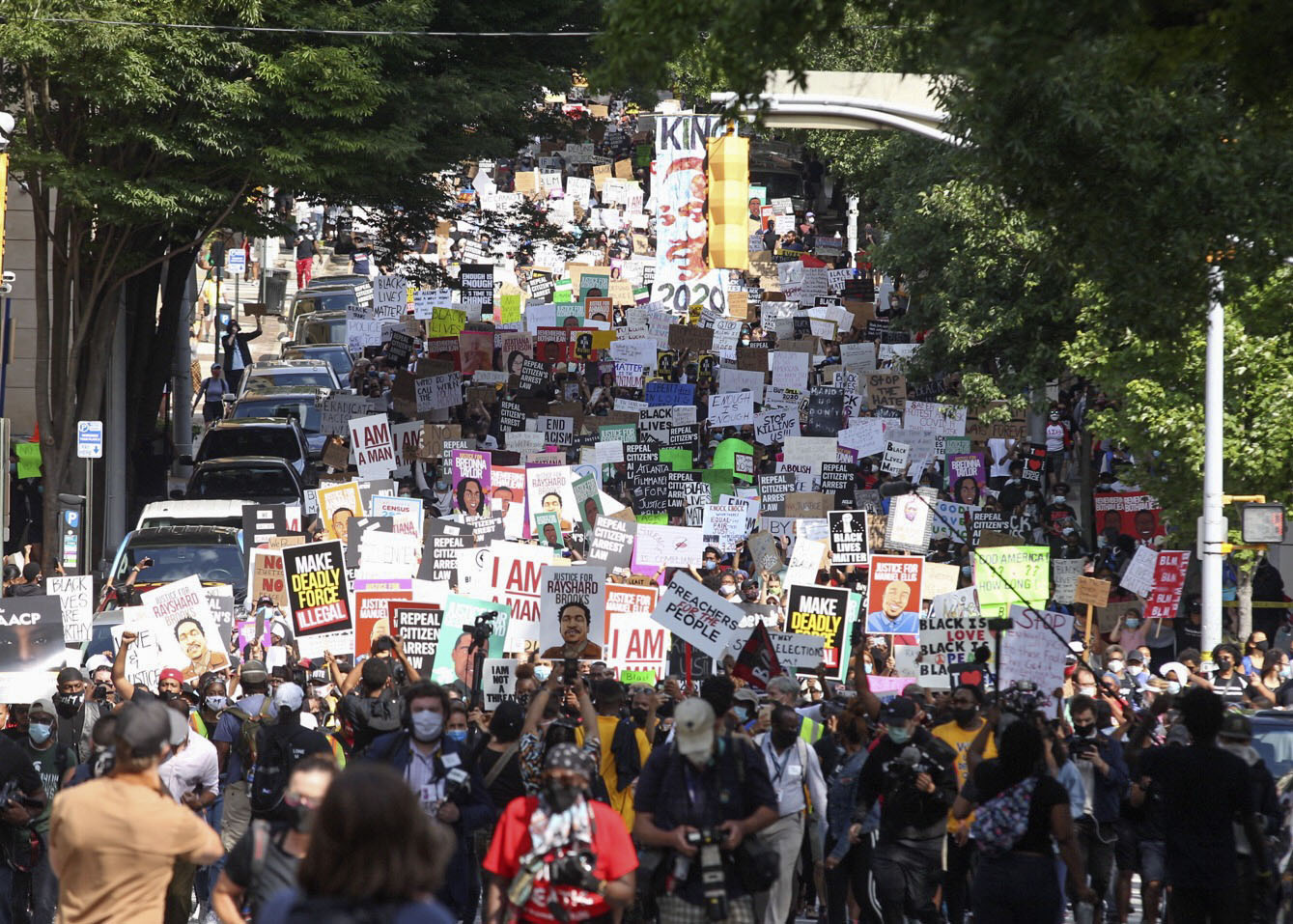June 15, 2020 - Atlanta - A crowd of demonstrators march to the Capitol. The NAACP March to the Capitol coincided with the restart of the Georgia 2020 General Assembly. Lawmakers returned wearing masks and followed new rules to restart the session during the pandemic. Steve Schaefer for the Atlanta Journal Constitution