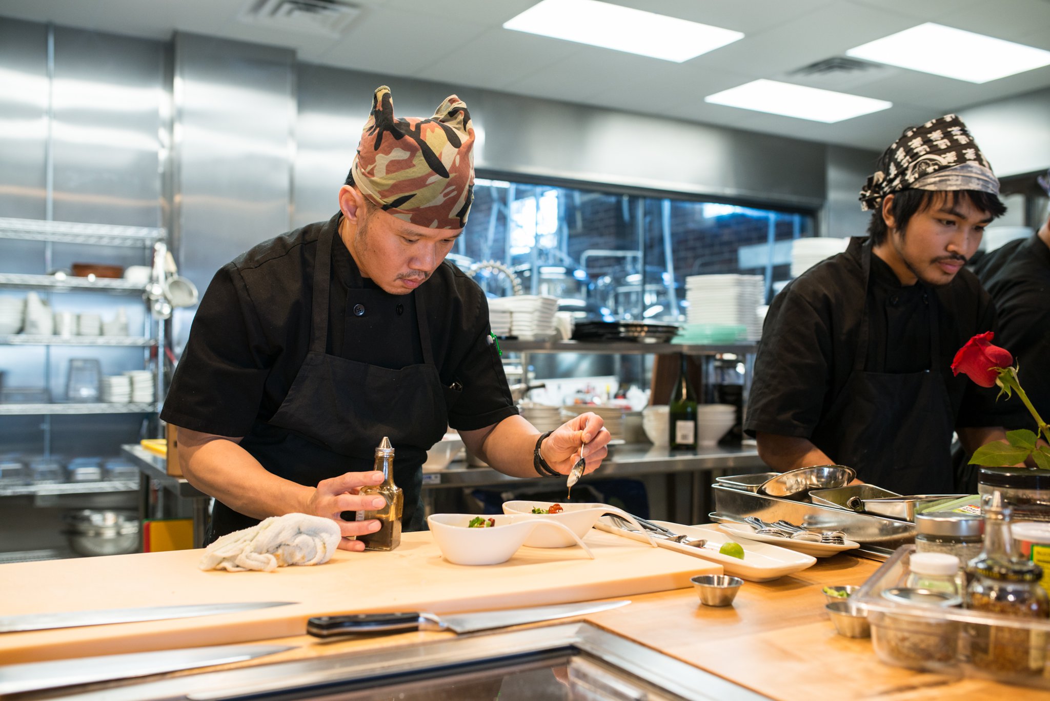 Executive chef Dony Raymond preparing seaweed salad in Hopstix kitchen. Photo credit- Mia Yakel.