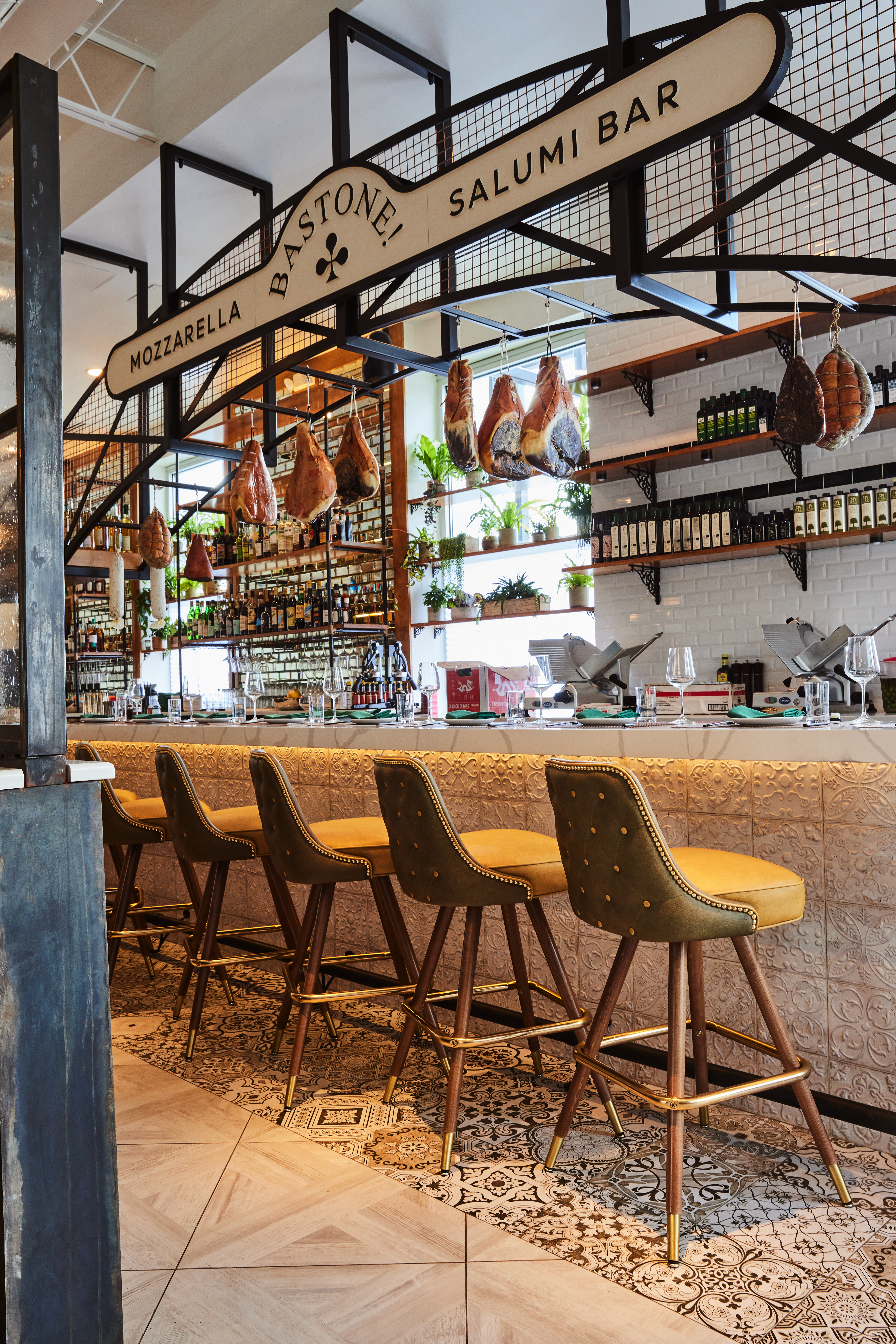 Grab a seat at Bastone's bar to watch the staff squeeze, stretch, fold and shape mozzarella. Courtesy of Kathryn McCrary Photography
