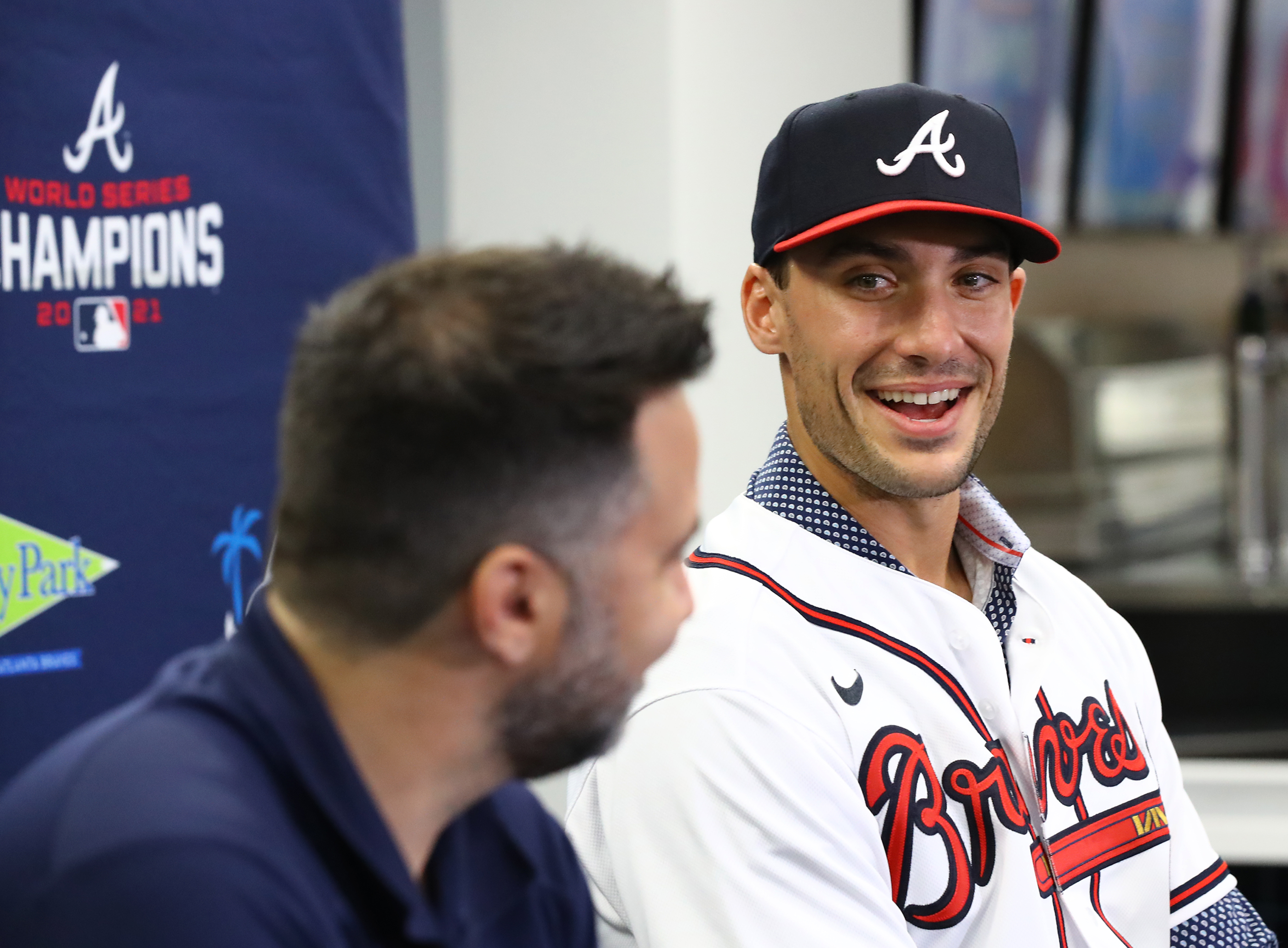 ATLANTA, GA - JANUARY 21: A young fan gets Braves first baseman Matt Olson  to autograph a baseball cap during the 2023 Braves Fest on January 21, 2023  at The Battery and