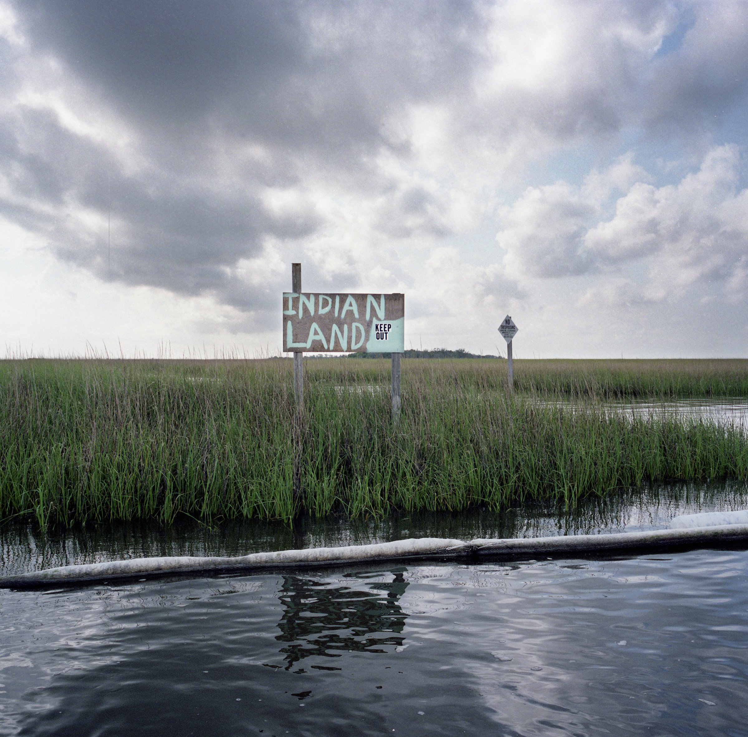 "Stranded Indian Land with Oil Boom, after the British Petroleum Oil Spill," 2010, by Kael Alford.
Contributed by Kael Alford / Panos Pictures / High Museum of Art