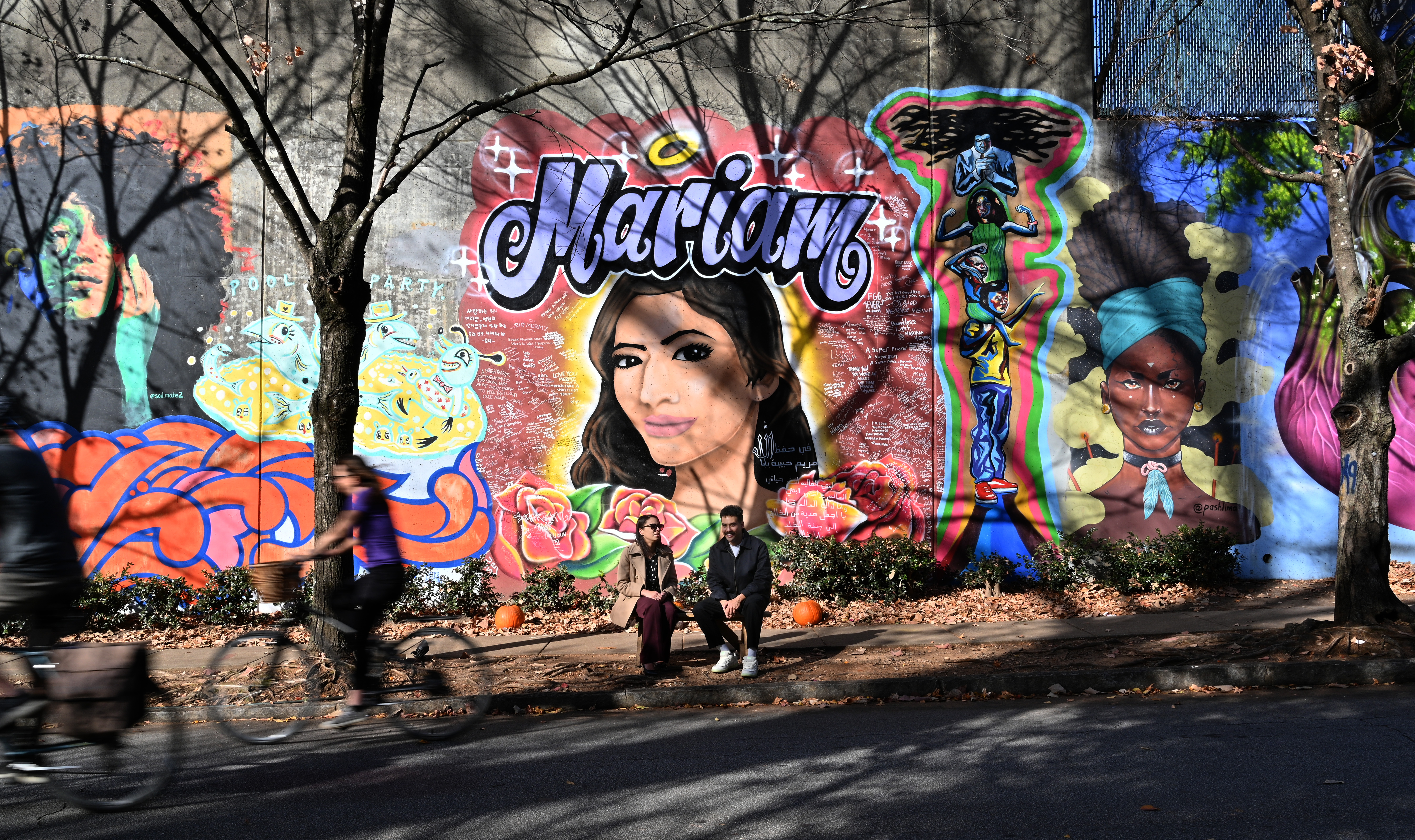 Ali Abdulrab and Asya Morgan talk in front of the mural of the murder victim Abdulrab's sister, Mariam, on Wylie Street near the Krog Street tunnel. Ali Abdulrab and Asya Morgan have become activists seeking to strengthen the way the state oversees sex offenders. (Hyosub Shin / Hyosub.Shin@ajc.com)