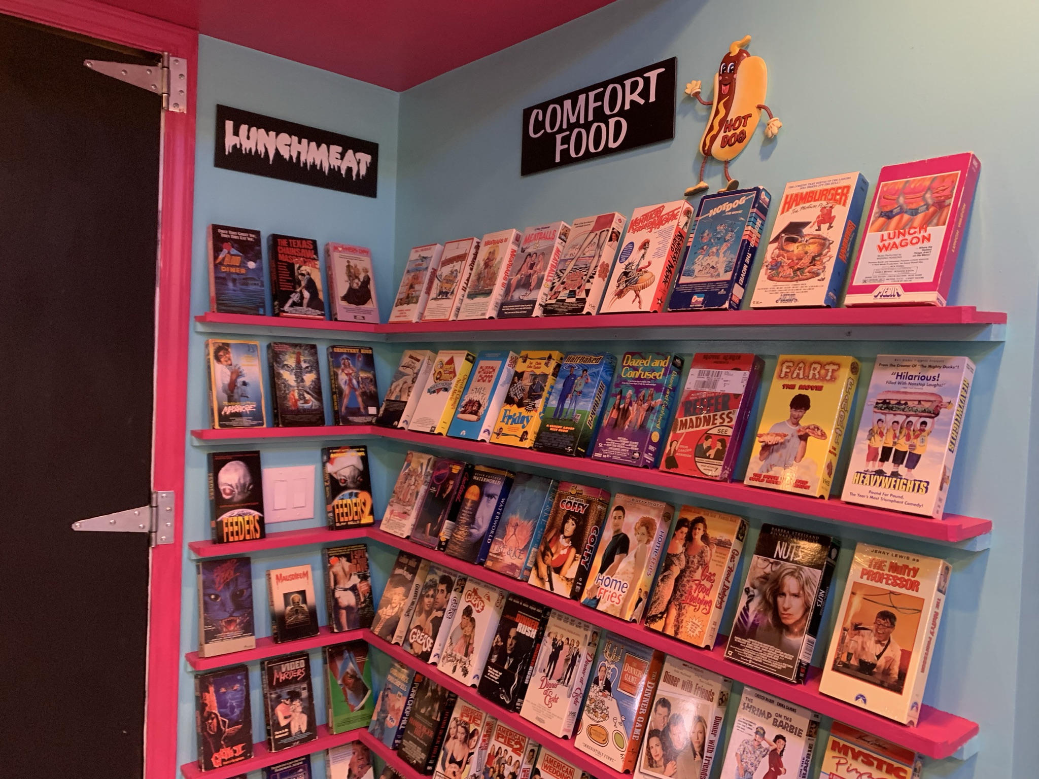 creates 1980s era video store in basement