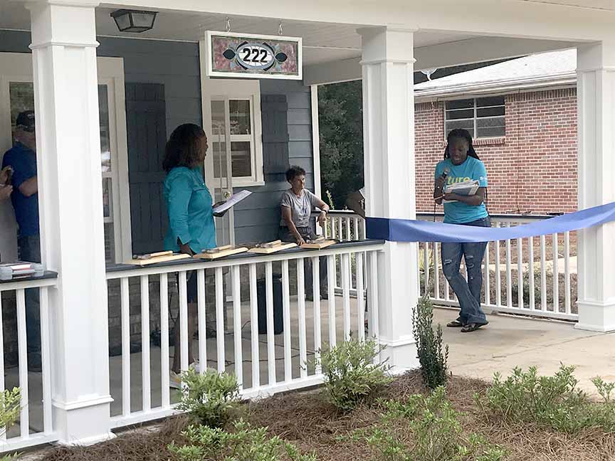 Shaquanna Denson (right) thanks Habitat for Humanity and others who helped build a new home for her and her son. (Photo: Alexis Stevens/Alexis.Stevens@ajc.com)
