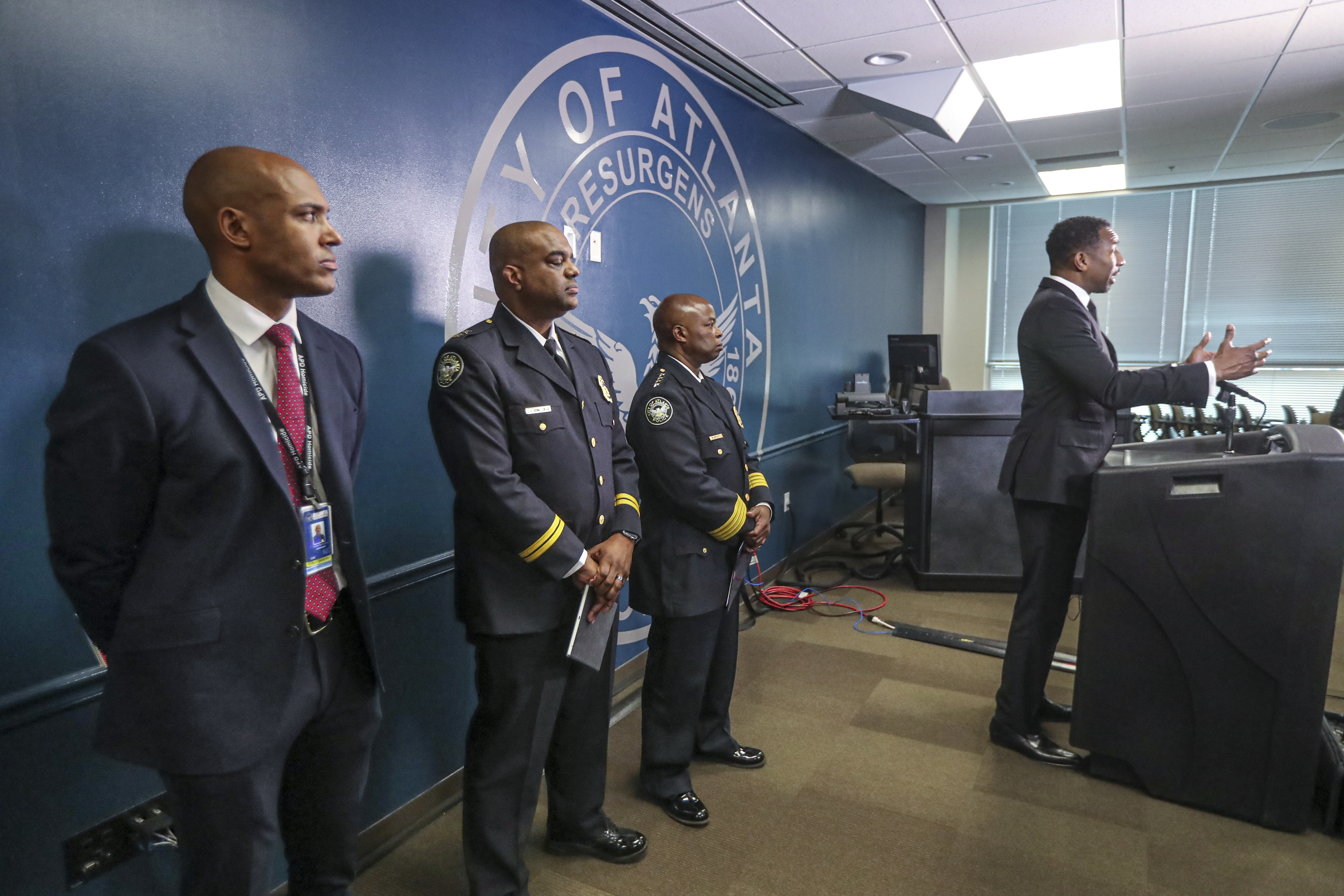 Atlanta Mayor Andre Dickens speaks at a press conference at APD headquarters as police command staff look on. (John Spink / John.Spink@ajc.com)