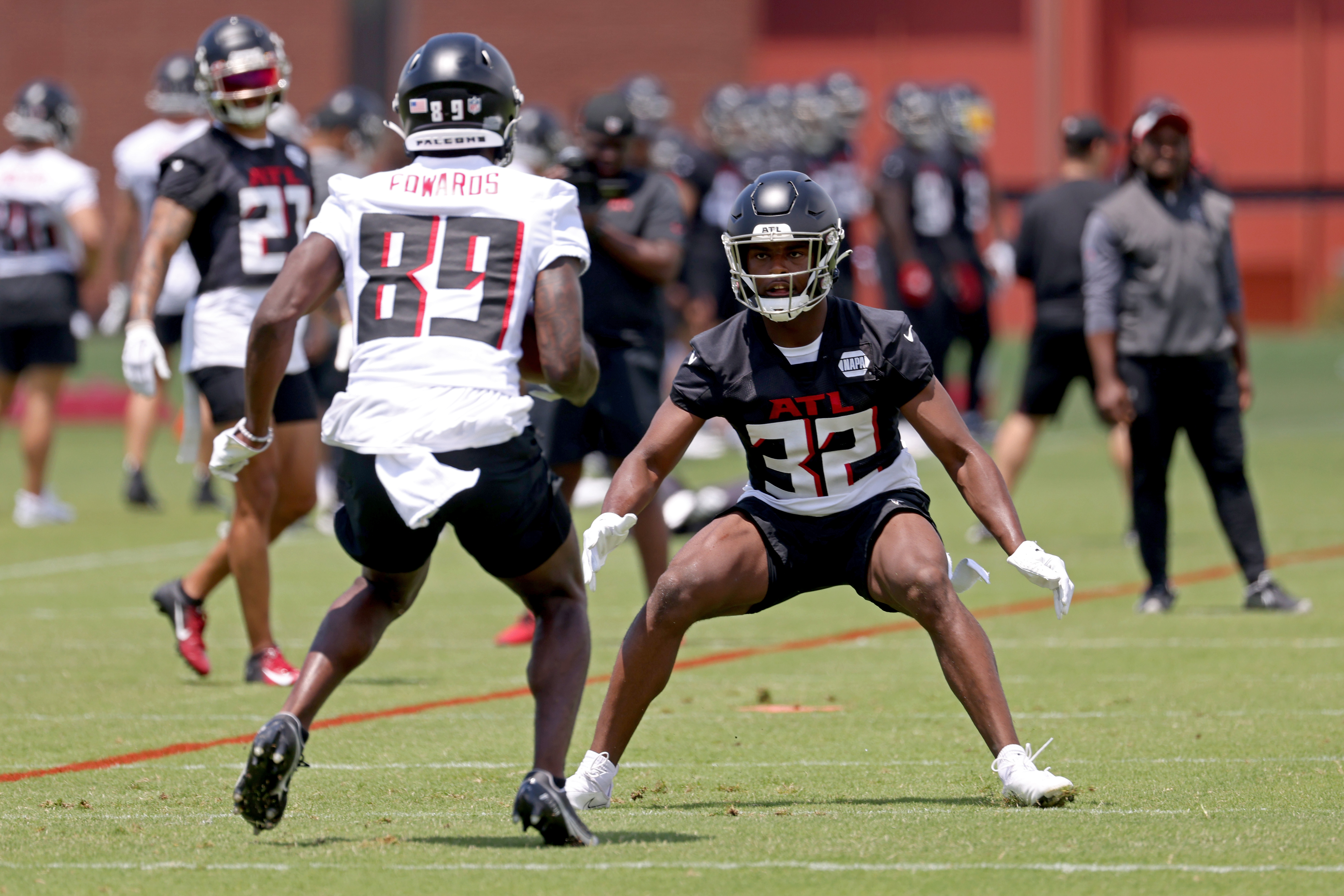 Atlanta Falcons safety Jaylinn Hawkins (32) works against