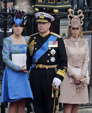 The hat that made the world gasp with horror. Prince Andrew (l-r) with his daughters Princess Eugenie and Princess Beatrice at the royal wedding of Will and Kate in 2011. Beatrice’s “fascinator,” which the British press uncharitably dubbed the “Squid Hat,” ended up being auctioned off for big charity bucks.