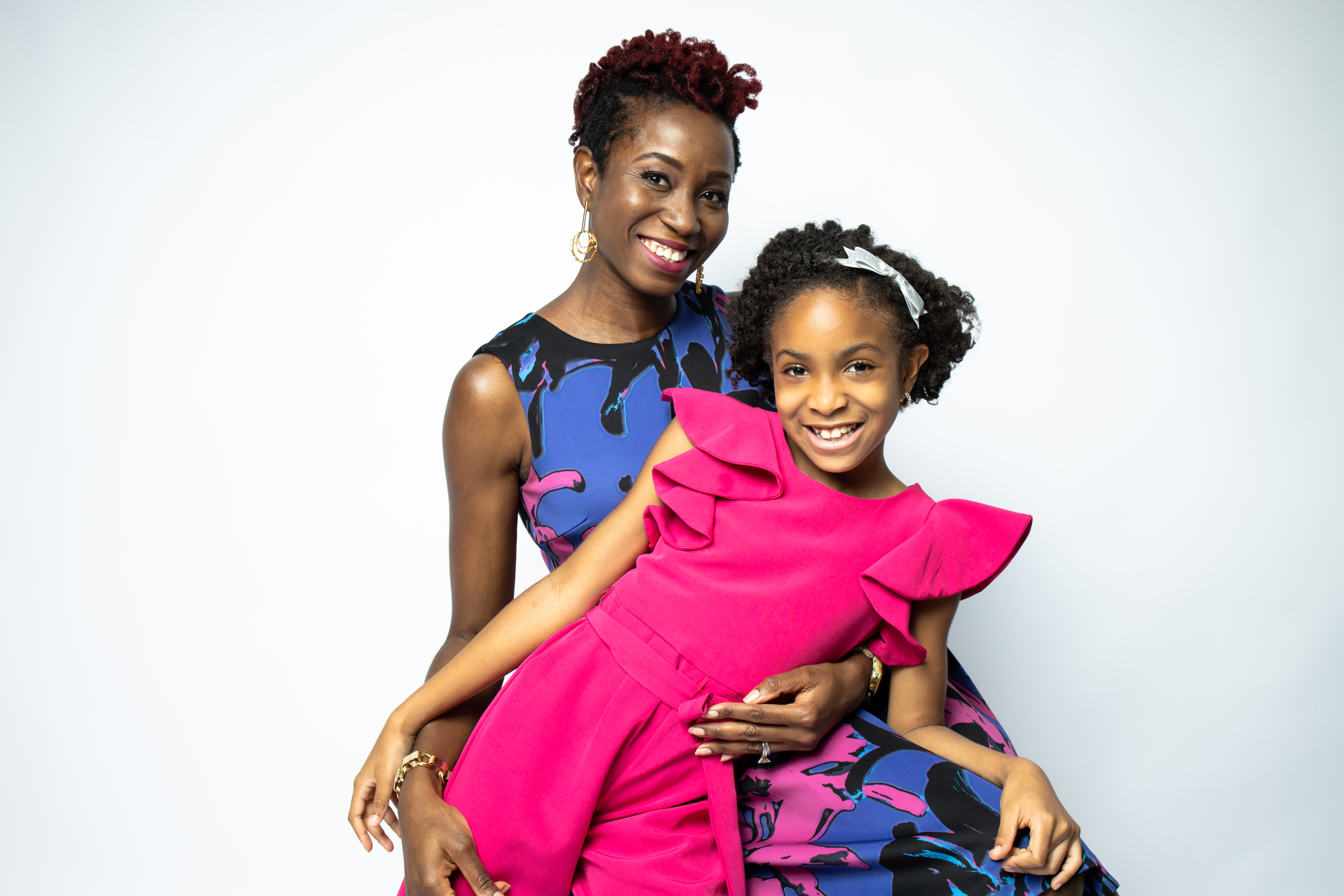 Evana and Zoe Oli developed a line of African American dolls with curly and braided hair.