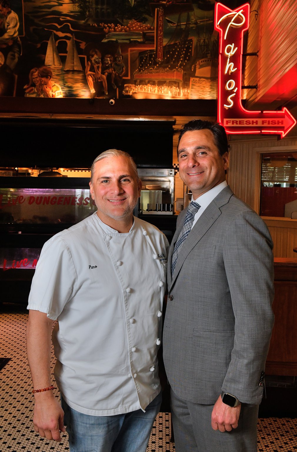 Brothers Pano I. (left) and Niko Karatassos inside the Atlanta Fish Market, which also houses the offices for the Buckhead Life Group.
