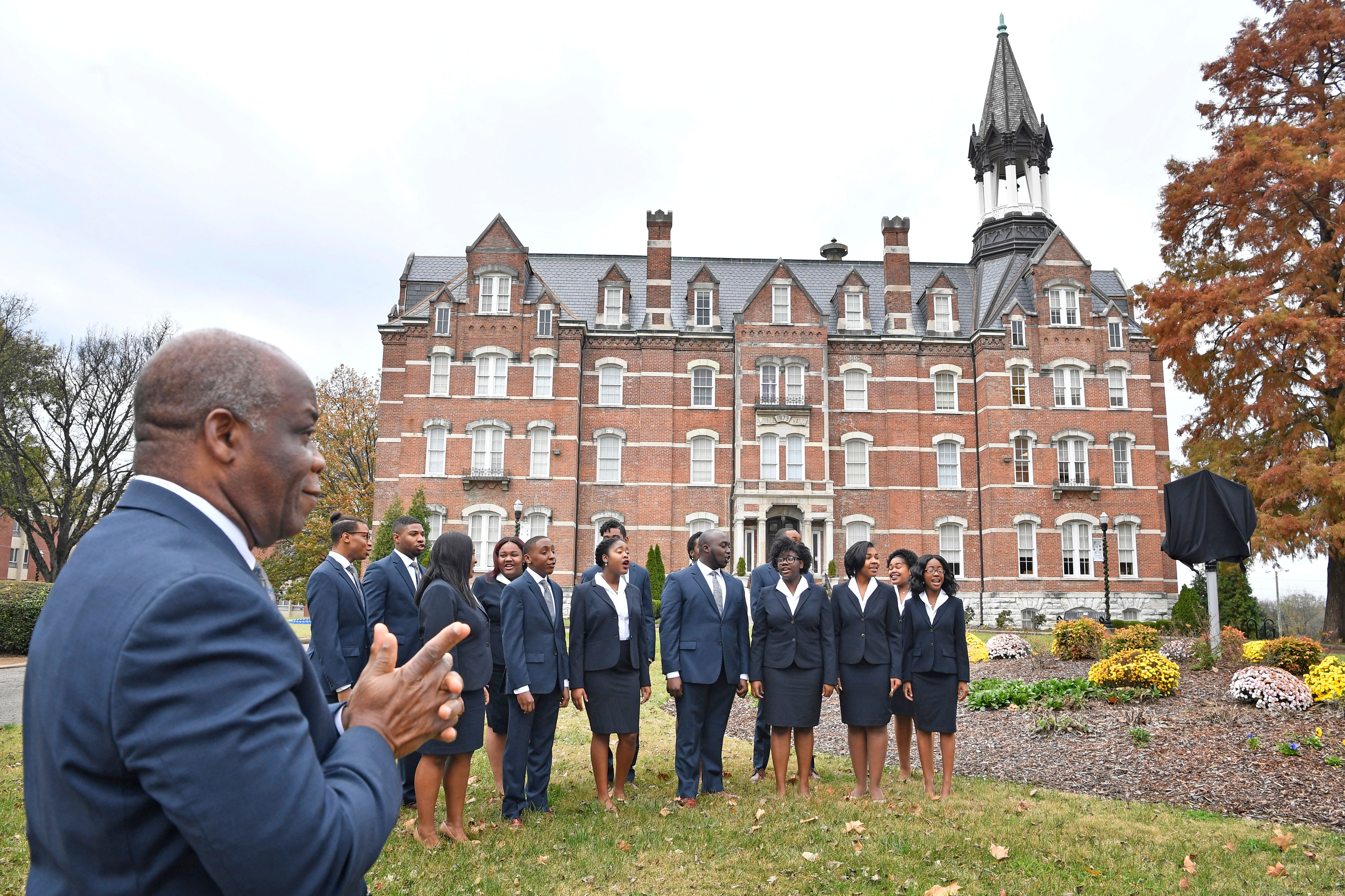 Dr. Paul T Kwami, Musical Director of the Fisk Jubilee Singers, listens as the Fisk Jubilee Singers sing a song as they were honored with a historic marker on the Fisk University campus. The marker commemorates the Singers and their departure from campus in 1871 to tour the United States and abroad to raise funds for Fisk University.