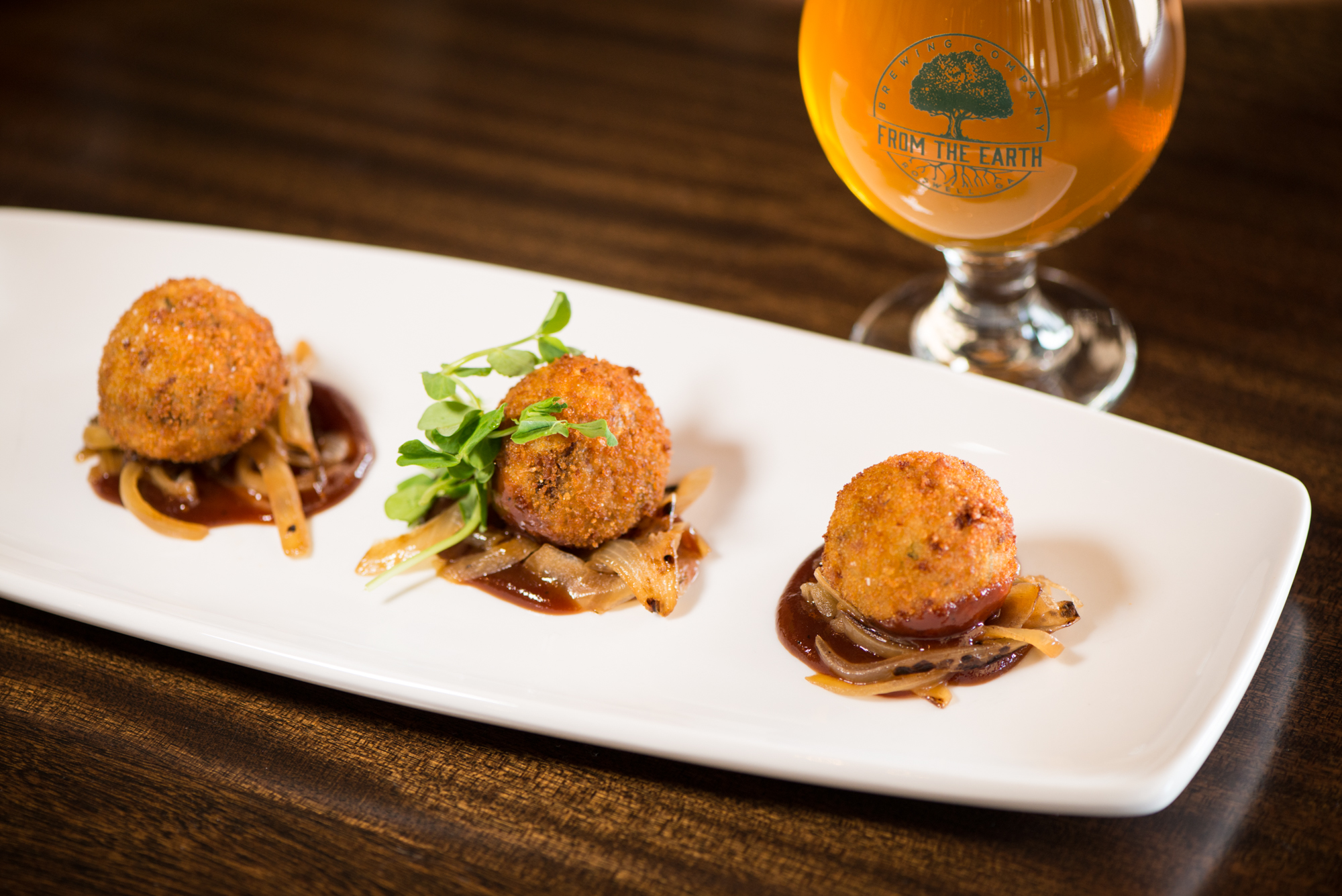 From the Earth 12 Hour Brisket and Cheddar Arancini with smoky bbq and bilstered onion. Photo credit- Mia Yakel.