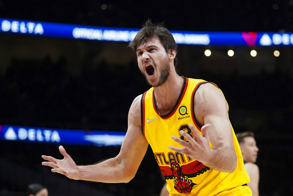 Atlanta Hawks forward Danilo Gallinari (8) reacts after being charged with a foul during the first half of an NBA basketball game against the Miami Heat Wednesday, Jan. 12, 2022, in Atlanta. (AP Photo/John Bazemore)