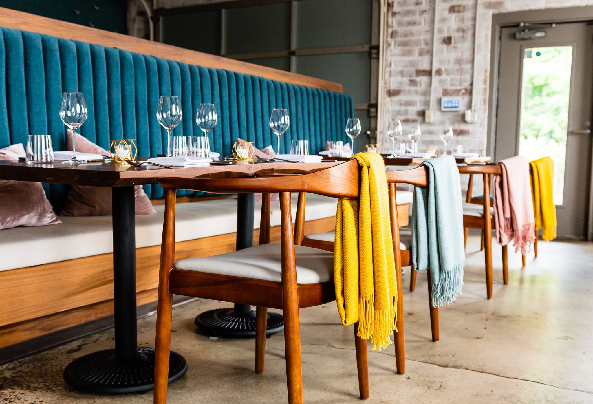 In the main dining room of Lazy Betty, throws are on the back of the chairs in case diners get chilly. CONTRIBUTED BY HENRI HOLLIS