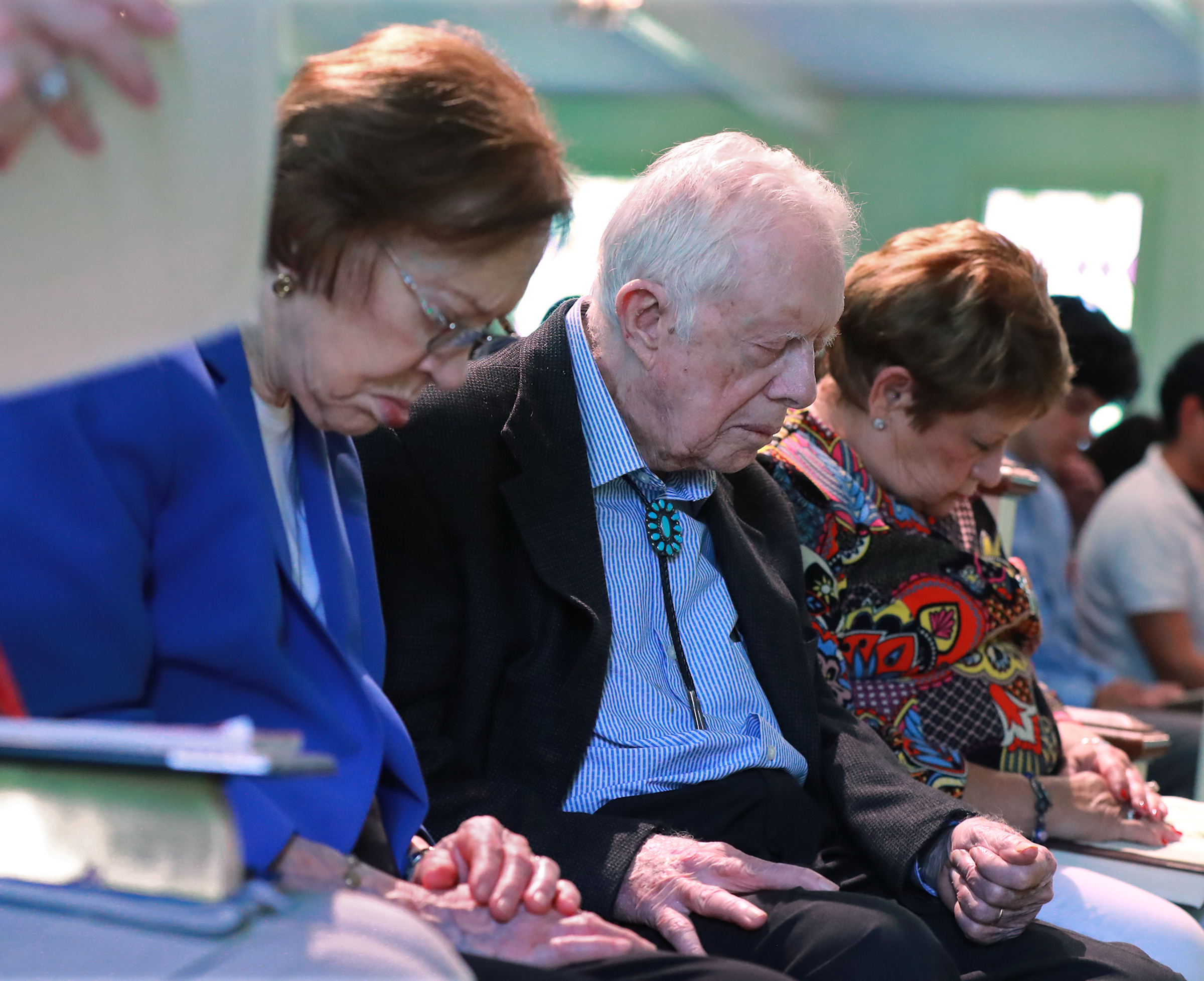 Former President Jimmy Carter and former first lady Rosalynn Carter bow their heads in prayer along with members and visitors during the worship service at Maranatha Baptist Church in Plains on Sunday, June 9, 2019, in Plains. (Photo: Curtis Compton/ccompton@ajc.com)
