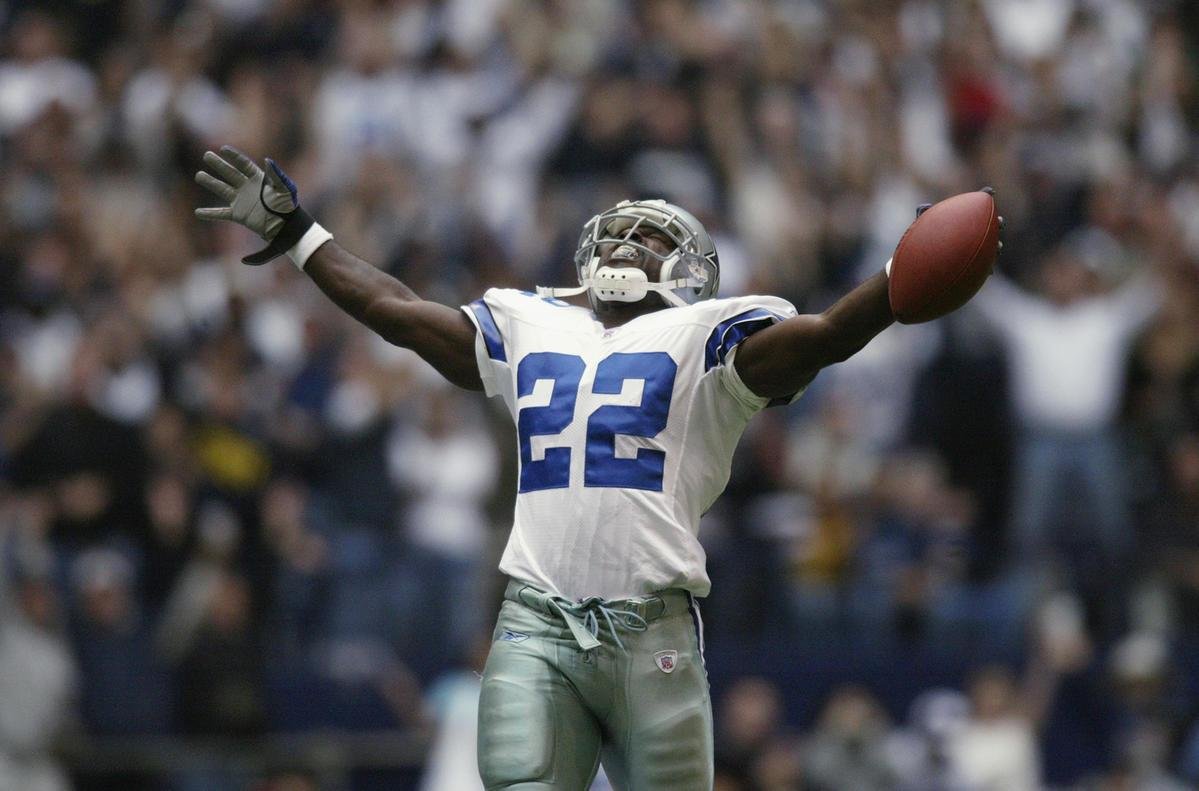 Darren Woodson of the Dallas Cowboys walking on the field during a