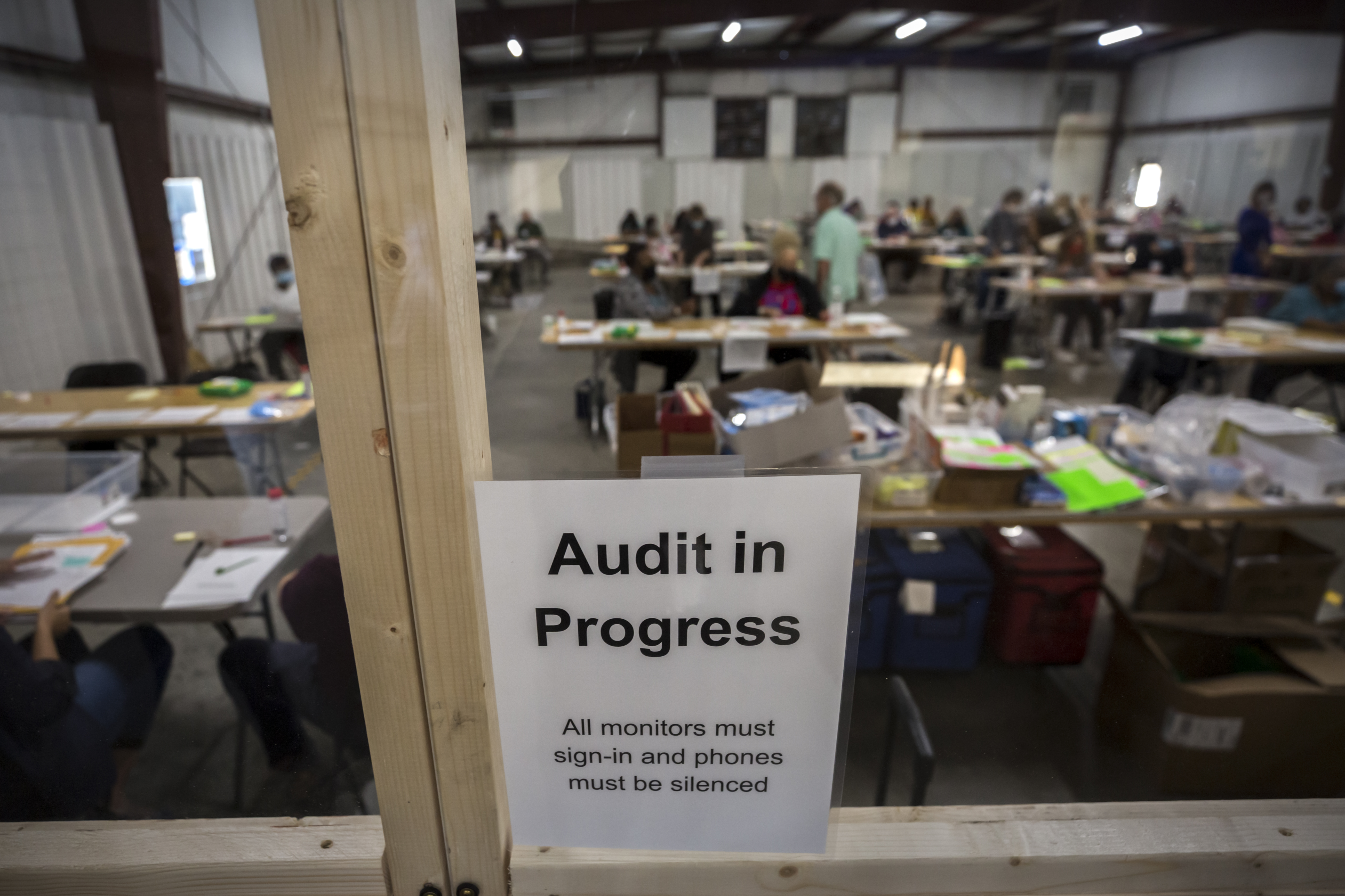 SAVANNAH, GA - NOVEMBER 14, 2020: Chatham County Board of Elections officials post signs in the public viewing area during the statewide audit of ballots from the 2020 election. (AJC Photo/Stephen B. Morton)