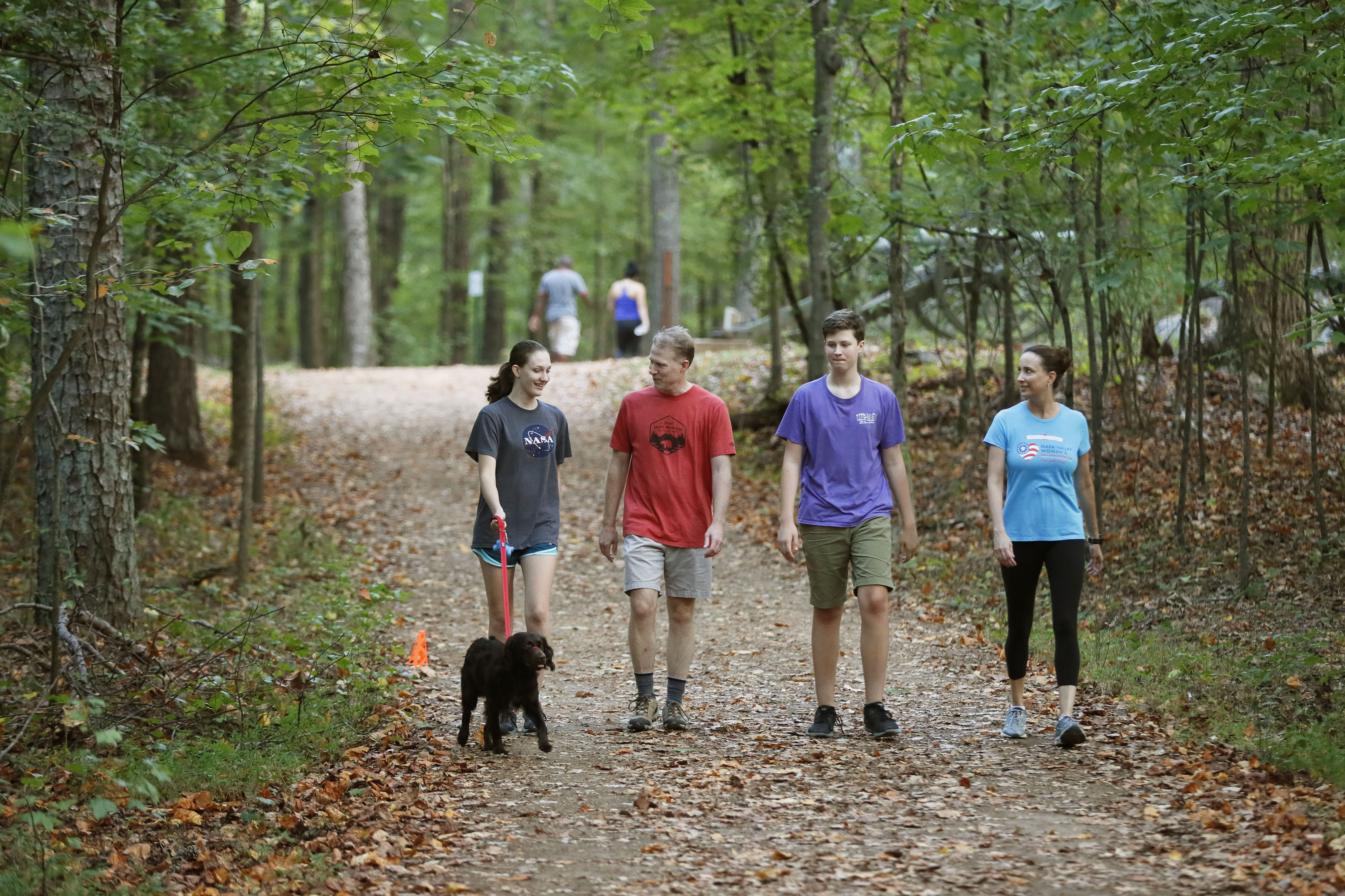 Karla Jacobs (right) goes on a family hike in with her daughter, Abby (from left), husband, Stephen, and son, Daniel, along Kennesaw Mountain National Battlefield Park trails near her home. Bob Andres / robert.andres@ajc.com