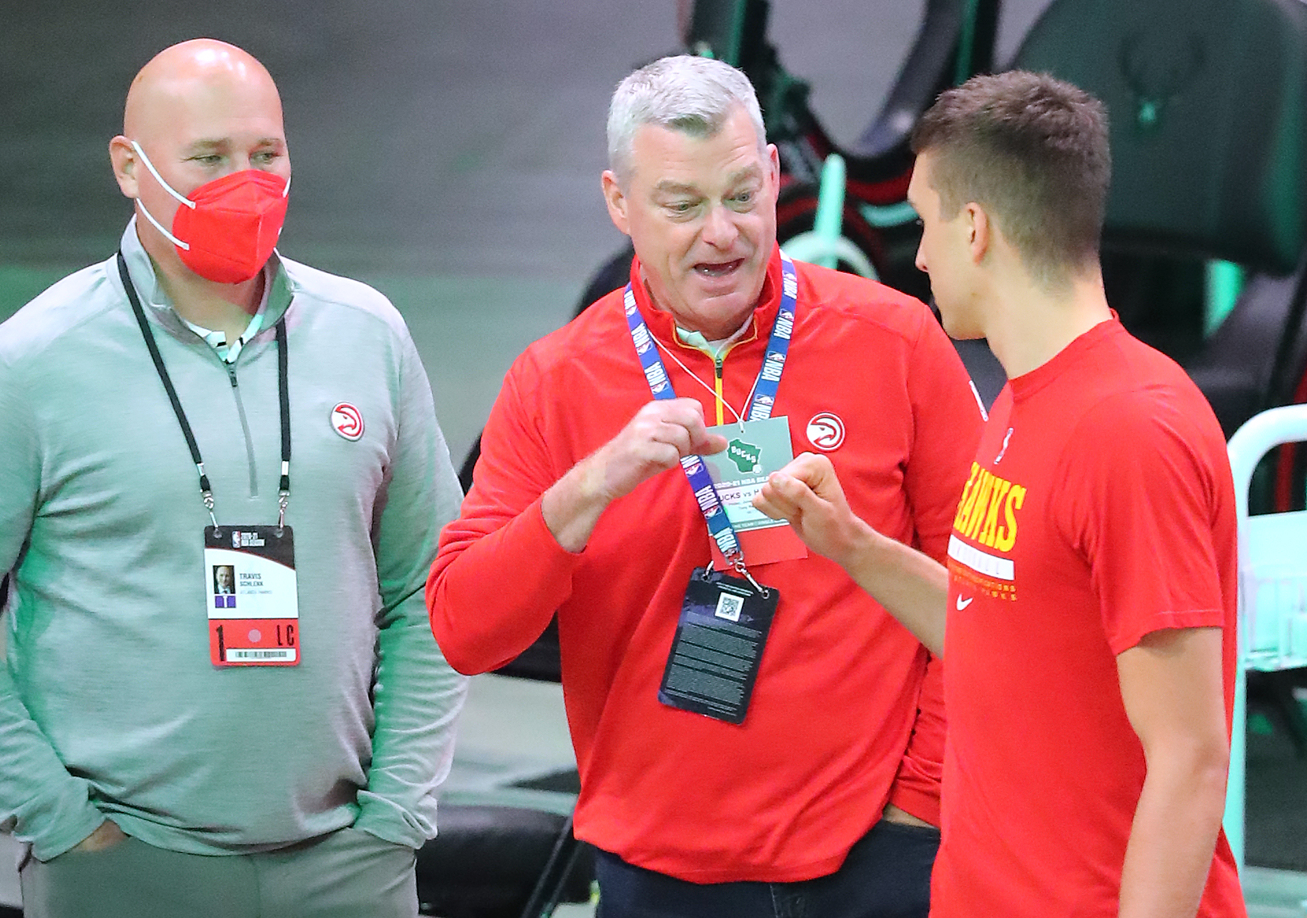 Hawks guard Bogan Bogdanovic gives owner Tony Ressler a fist bump with general manager and president Travis Schlenk before playing the Milwaukee Bucks in game 2 of the NBA Eastern Conference Finals on Friday, June 25, 2021, in Milwaukee. “Curtis Compton / Curtis.Compton@ajc.com”