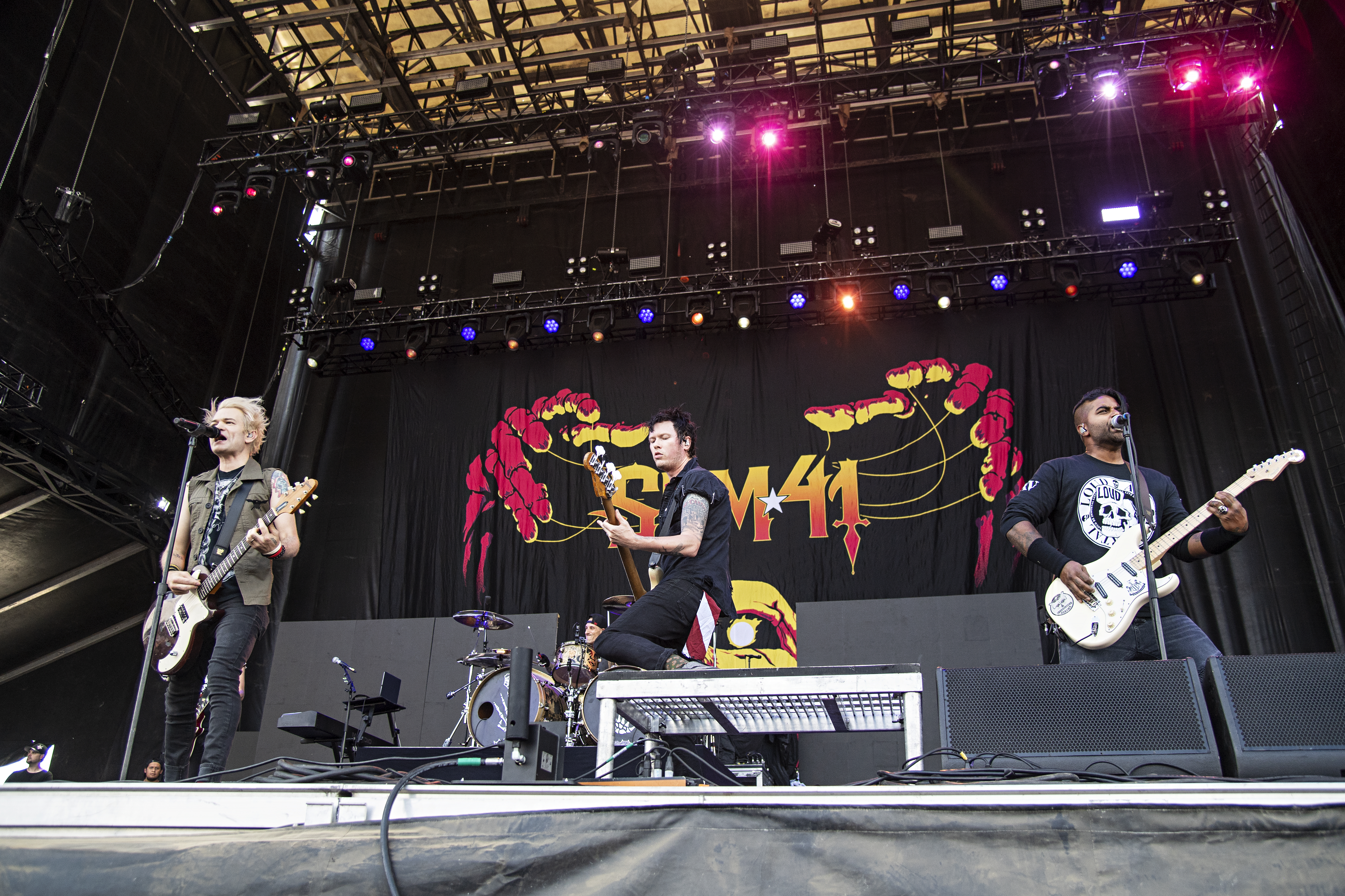 Deryck Whibley, from left, Jason McCaslin, and Dave Baksh of Sum 41 perform during Louder Than Life at Highland Festival Grounds at KY Expo Center on Sunday, Sept. 29, 2019, in Louisville, Ky. (Photo by Amy Harris/Invision/AP)
