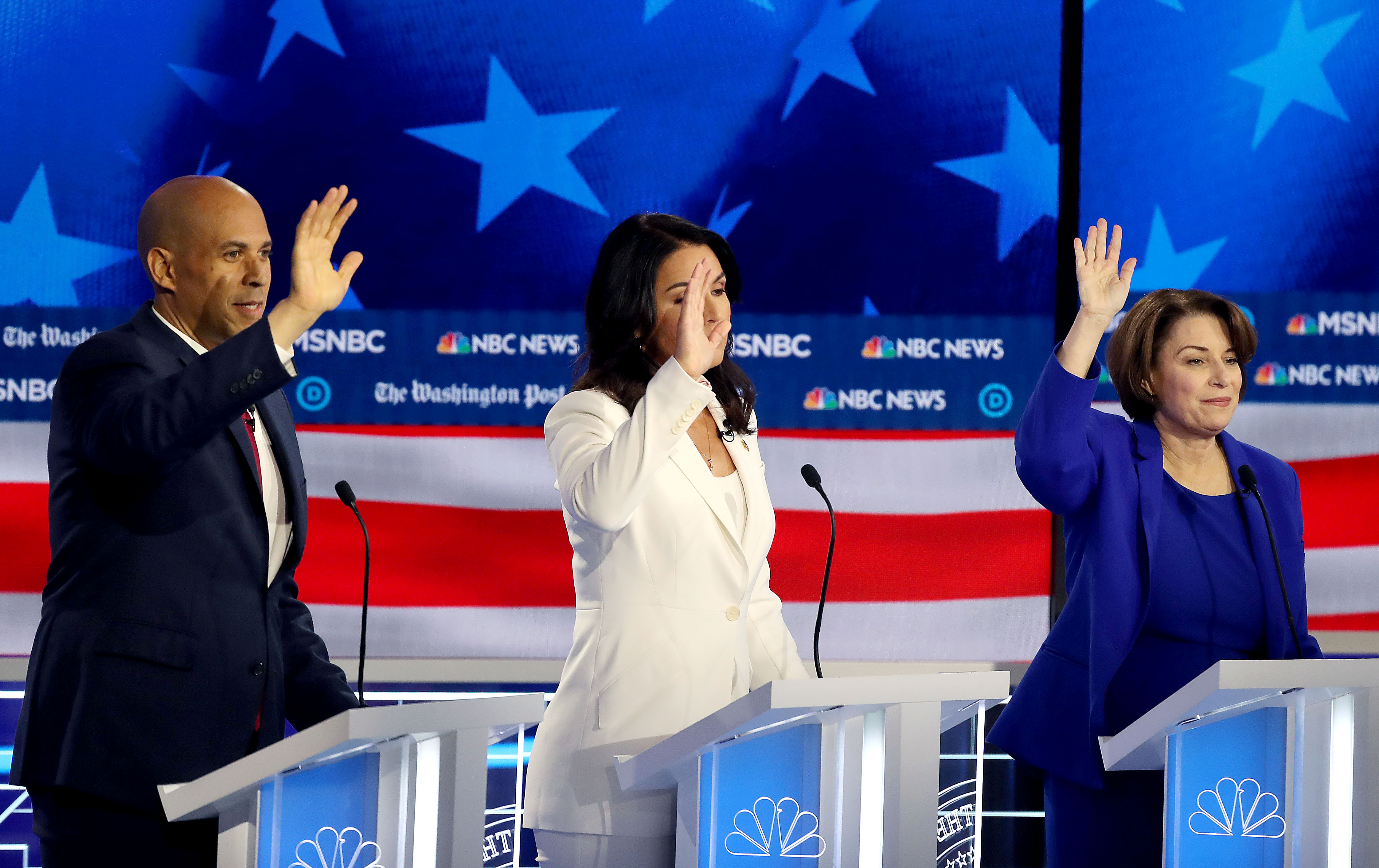 11/20/2019 -- Atlanta, Georgia -- (L to R) Senator Cory Booker, Representative Tulsi Gabbard, and Senator Amy Klobuchar all try to get the attention of the moderators, during the MSNBC/The Washington Post Democratic Presidential debate inside the Oprah Winfrey Soundstage at Tyler Perry Studios, Monday, November 20, 2019. (Alyssa Pointer/Atlanta Journal Constitution)