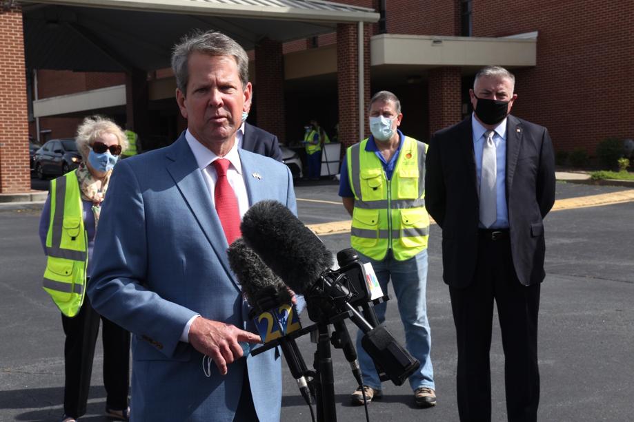 At a media briefing Friday outside a testing facility in Gwinnett County, Gov. Brian Kemp said he doesn’t plan to impose new restrictions or require the use of masks to combat the spread of disease. He said mandating masks is a “bridge too far for me right now,” but urged Georgians to wear them and practice social distancing. AJC / STEVE SCHAEFER