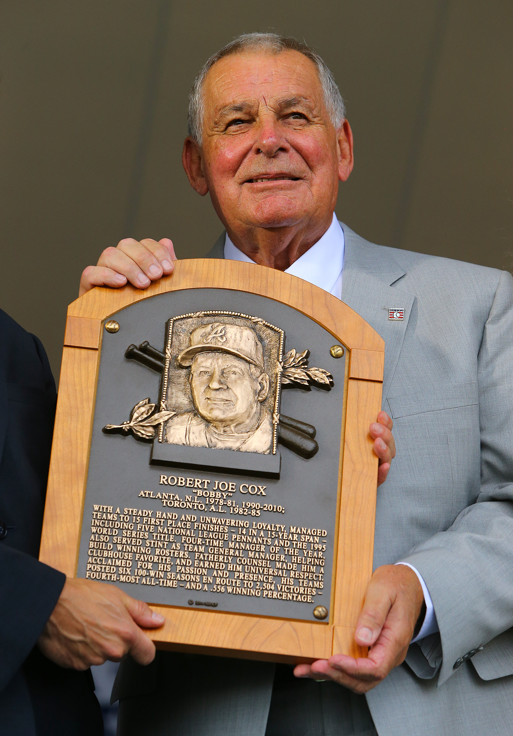 Bobby Cox is presented his plaque during the National Baseball Hall of Fame Induction Ceremony at Clark Sports Center on Sunday, July 27, 2014, in Cooperstown. CURTIS COMPTON / CCOMPTON@AJC.COM