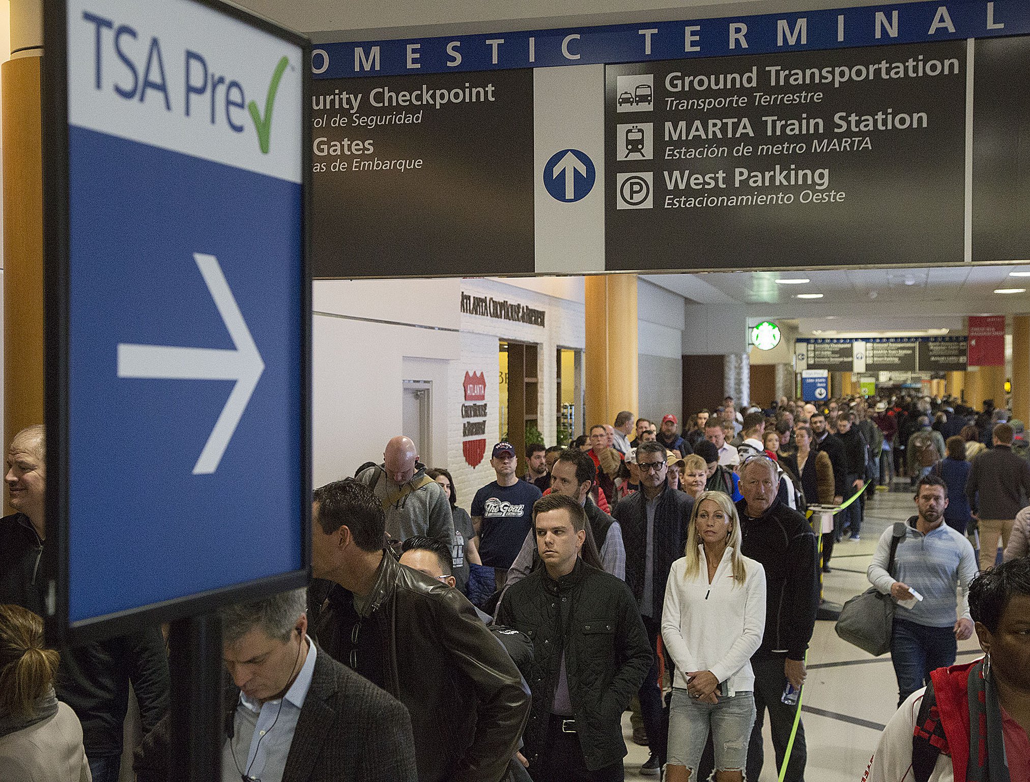 Multiple security lines at Hartsfield-Jackson International Airport ran across the atrium then snaked through baggage claim in both domestic terminals on Monday February 4th, 2019. Official expected over 100,00 travelers to pass through the airport today. (Photo by Phil Skinner)