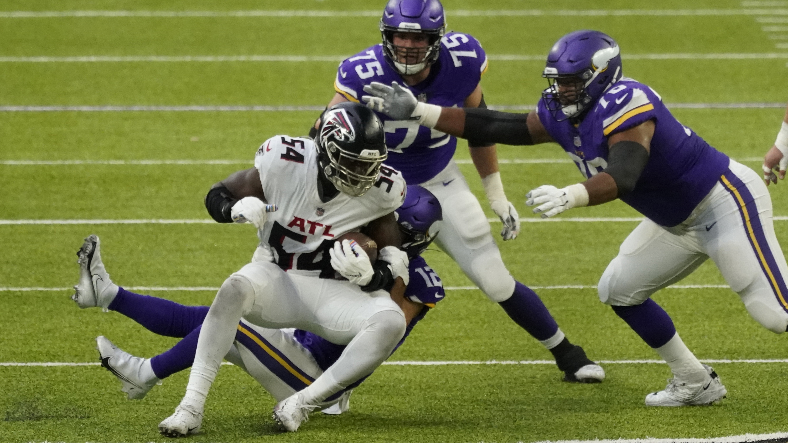 Atlanta Falcons linebacker Deion Jones (45) intercepts a pass intended for  Minnesota Vikings wide receiver Justin Jefferson (18) during the first half  of an NFL football game, Sunday, Oct. 18, 2020, in